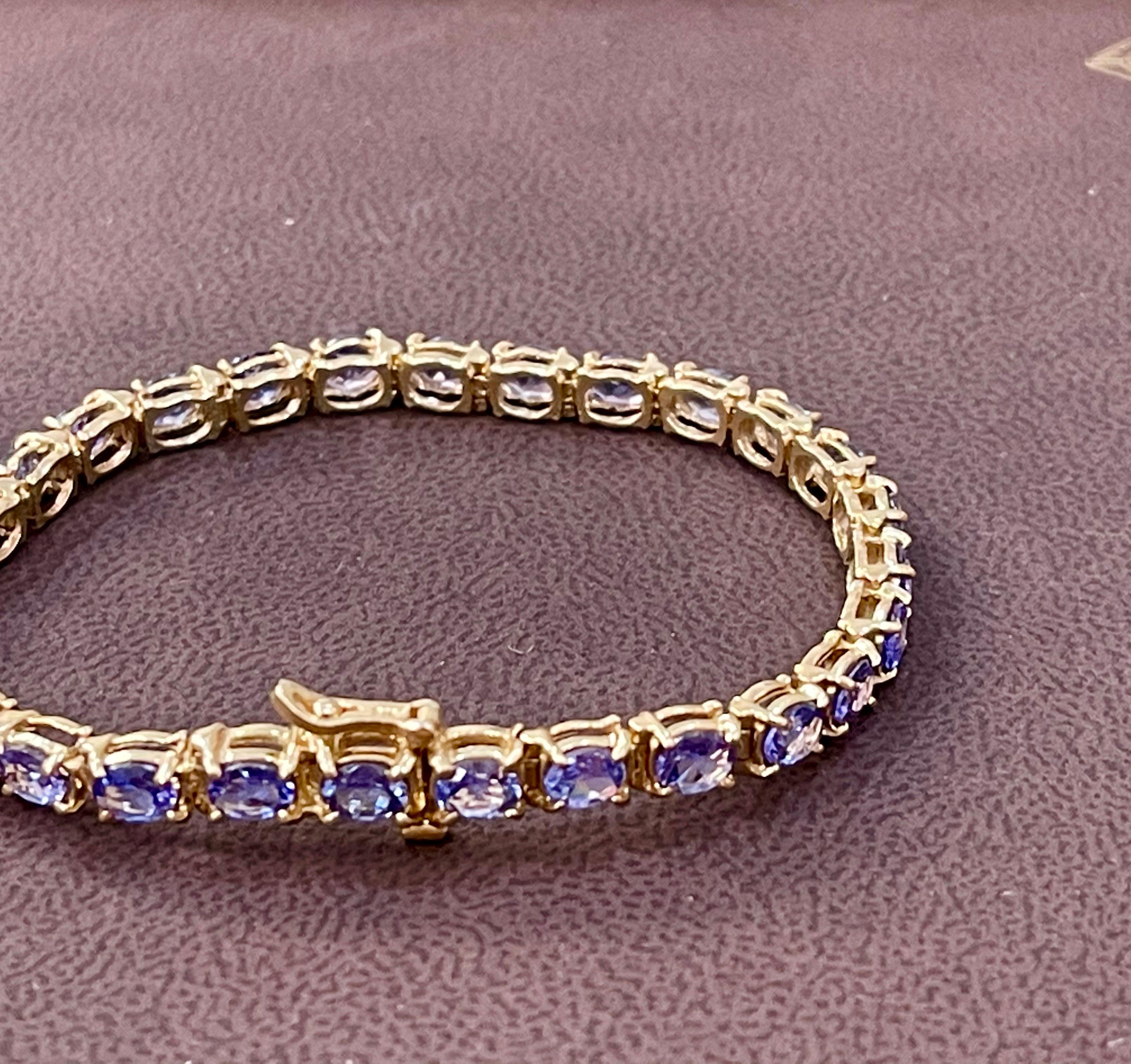 Natural 9 Carat Oval Tanzanite Tennis Bracelet 14 Karat Yellow Gold 1