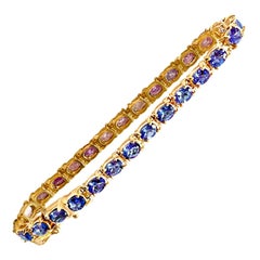 Natural 9 Carat Oval Tanzanite Tennis Bracelet 14 Karat Yellow Gold