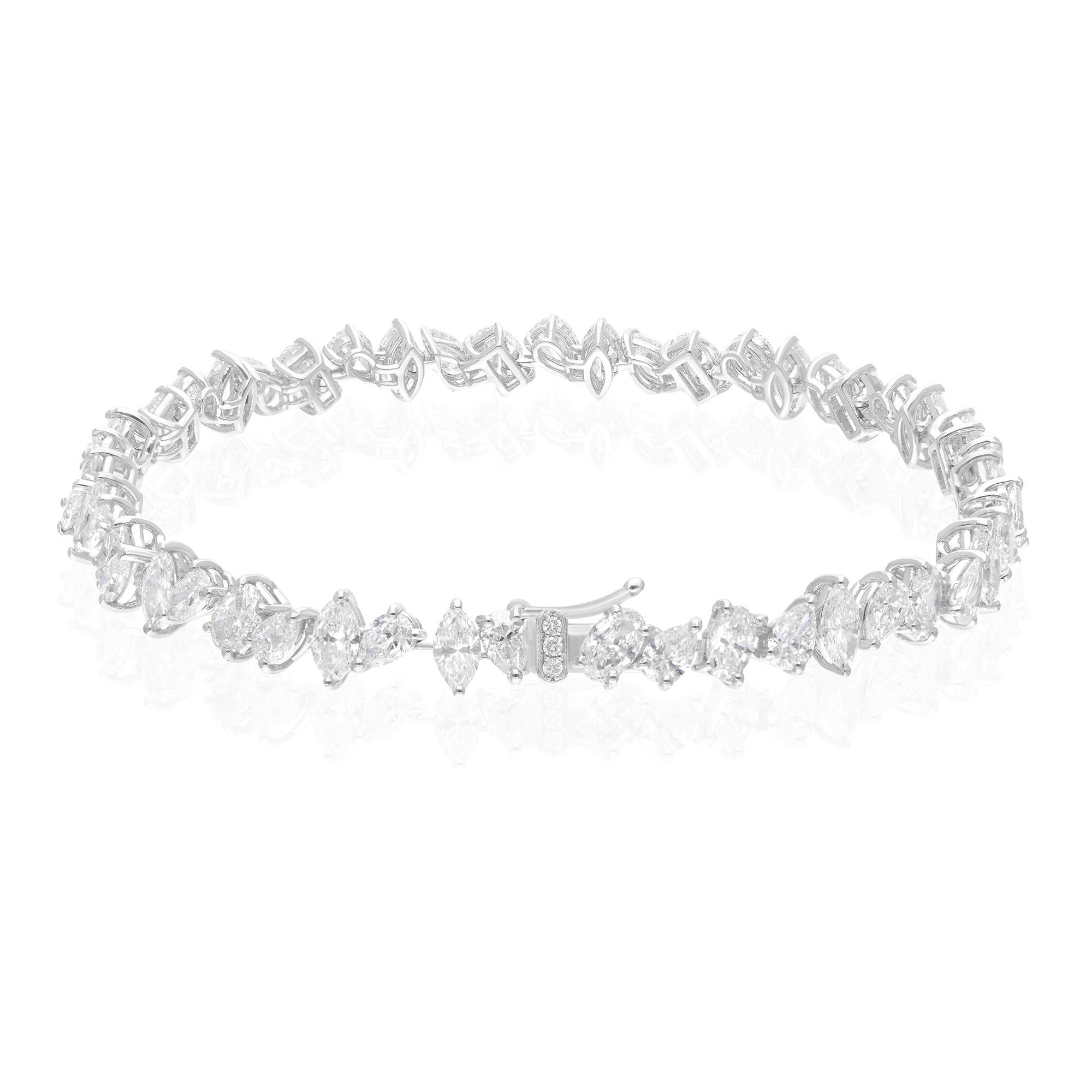 Adorn your wrist with the unparalleled brilliance and luxury of this handmade natural diamond bracelet, featuring an impressive total weight of 9.67 carats of multi-shaped diamonds, set in exquisite 18 karat white gold. This bracelet is a true