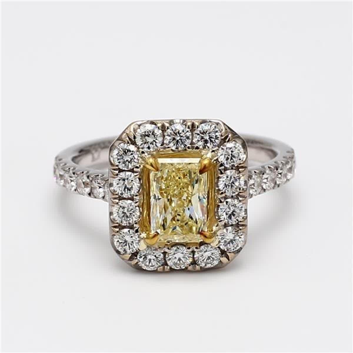 RareGemWorld's classic diamond ring. Mounted in a beautiful 18K Yellow and White Gold setting with a natural radiant cut yellow diamond. The yellow diamond is surrounded by small round natural white diamond melee. This ring is guaranteed to impress
