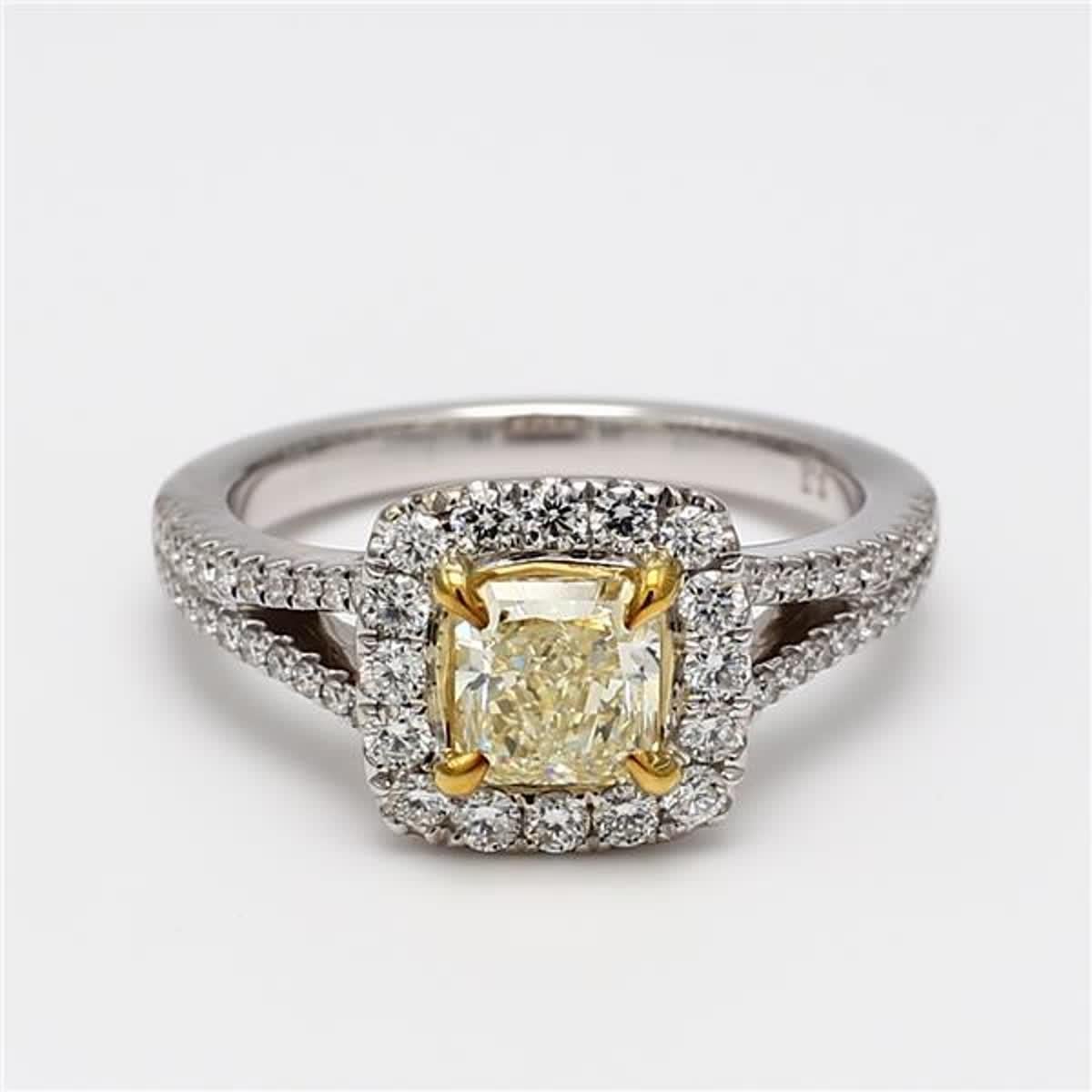 RareGemWorld's classic diamond ring. Mounted in a beautiful 18K Yellow and White Gold setting with a natural radiant cut yellow diamond. The yellow diamond is surrounded by small round natural white diamond melee. This ring is guaranteed to impress