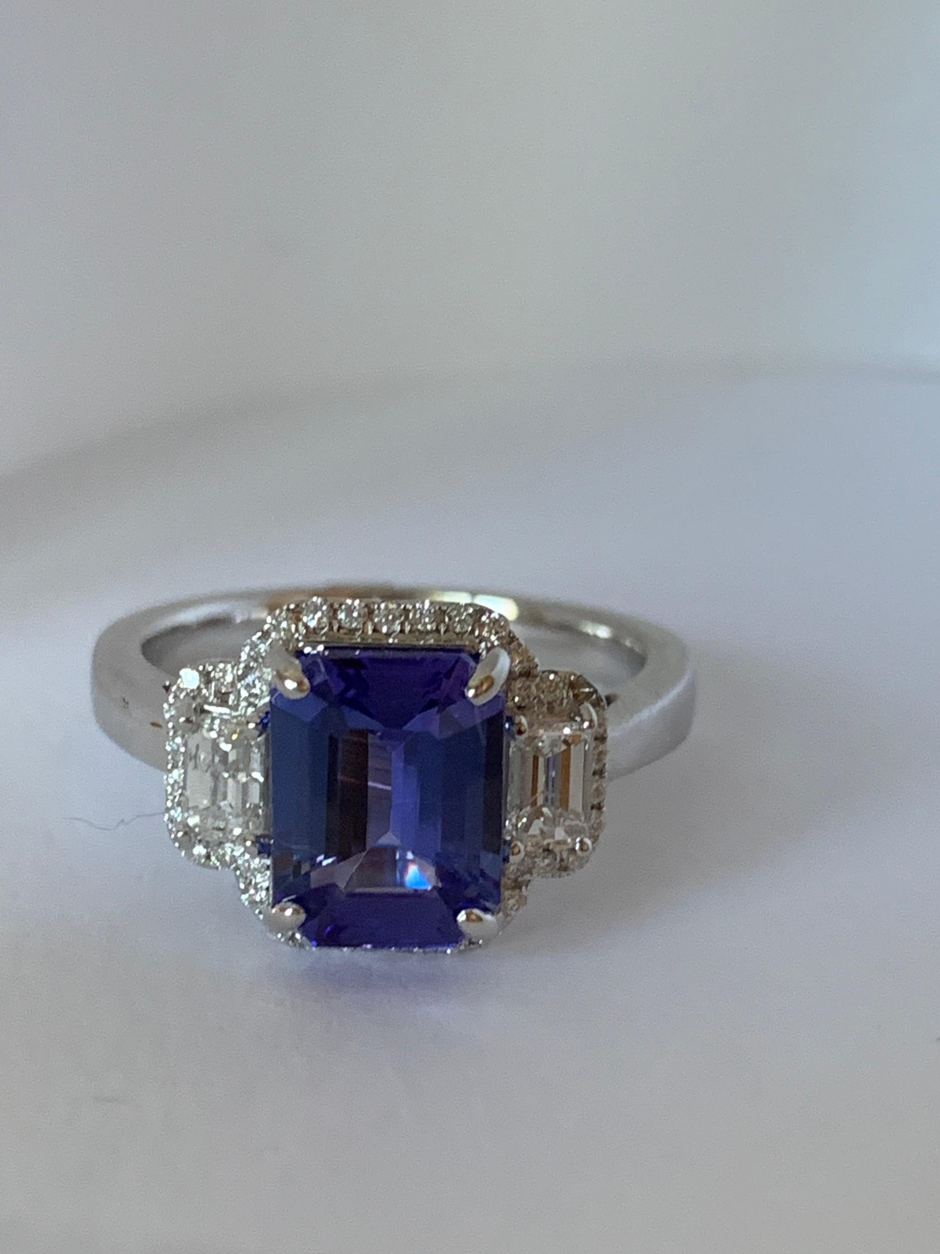 Contemporary Natural AAA Quality Tanzanite and Diamond Ring For Sale