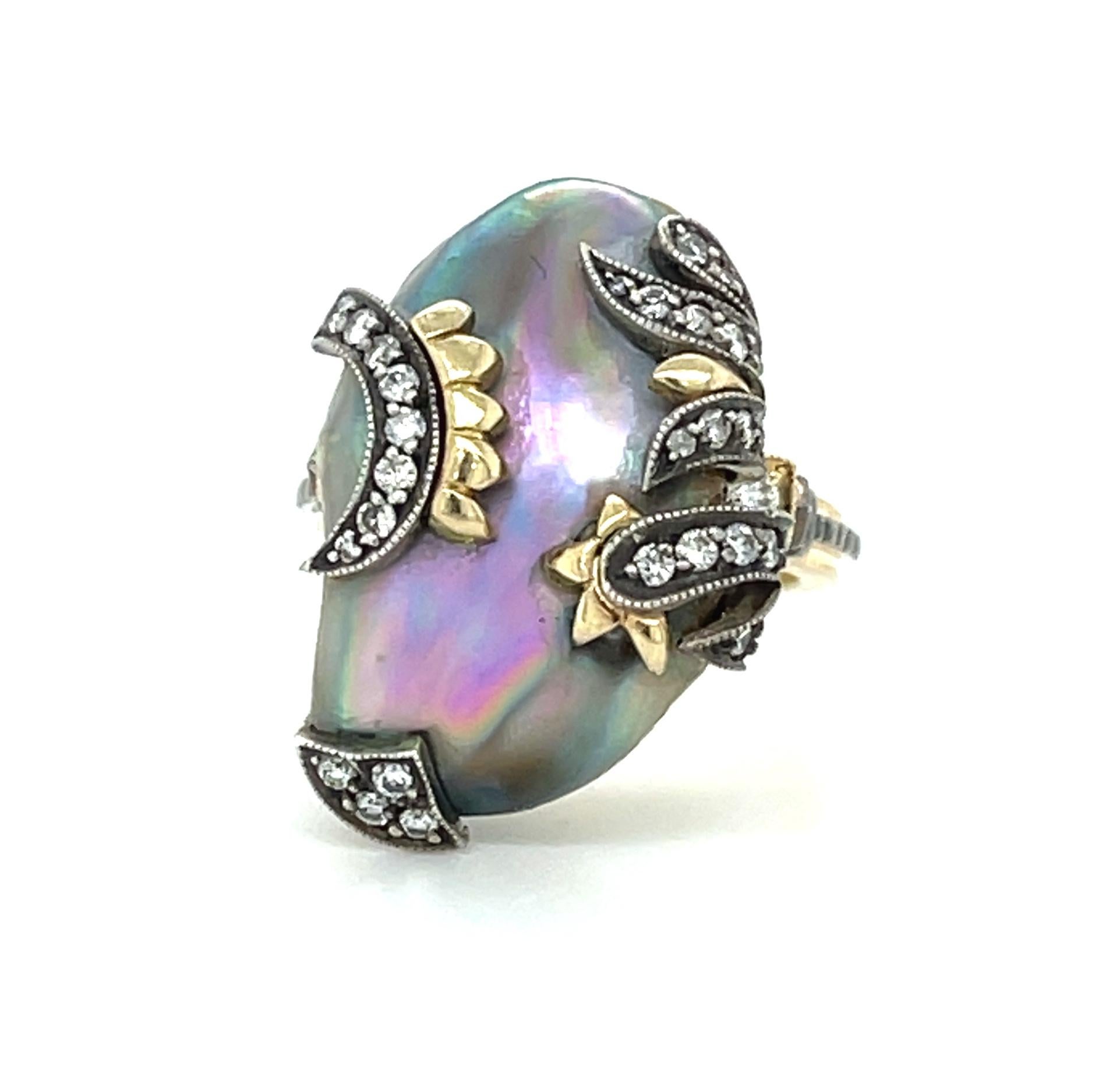 This eye-catching ring features a large, 16.60 carat natural abalone pearl set in 18k yellow and white gold. Abalone pearls are not cultured like most commercially available pearls seen in fine jewelry. They form naturally and are highly prized