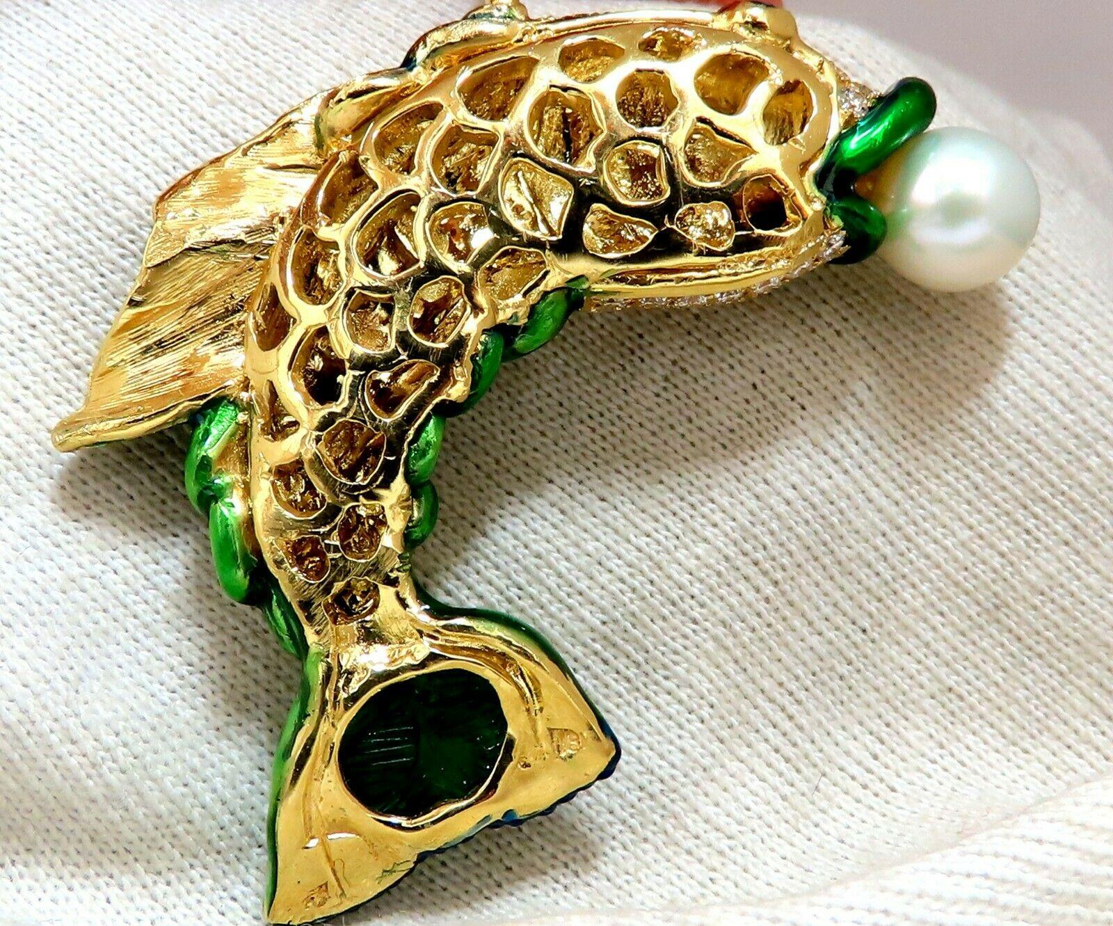 Lucky Catch.

9.5mm Natural Japanese Akoya Pearl
5.50ct. Natural Diamonds fish pendant.
Custom Handmade made 
Rounds and Baguettes.
G-color, Vs-2 clarity

.24ct Natural Round Sapphire (Eye)
4.00ct Natural Carved Green Emerald (Tail)
3D domed