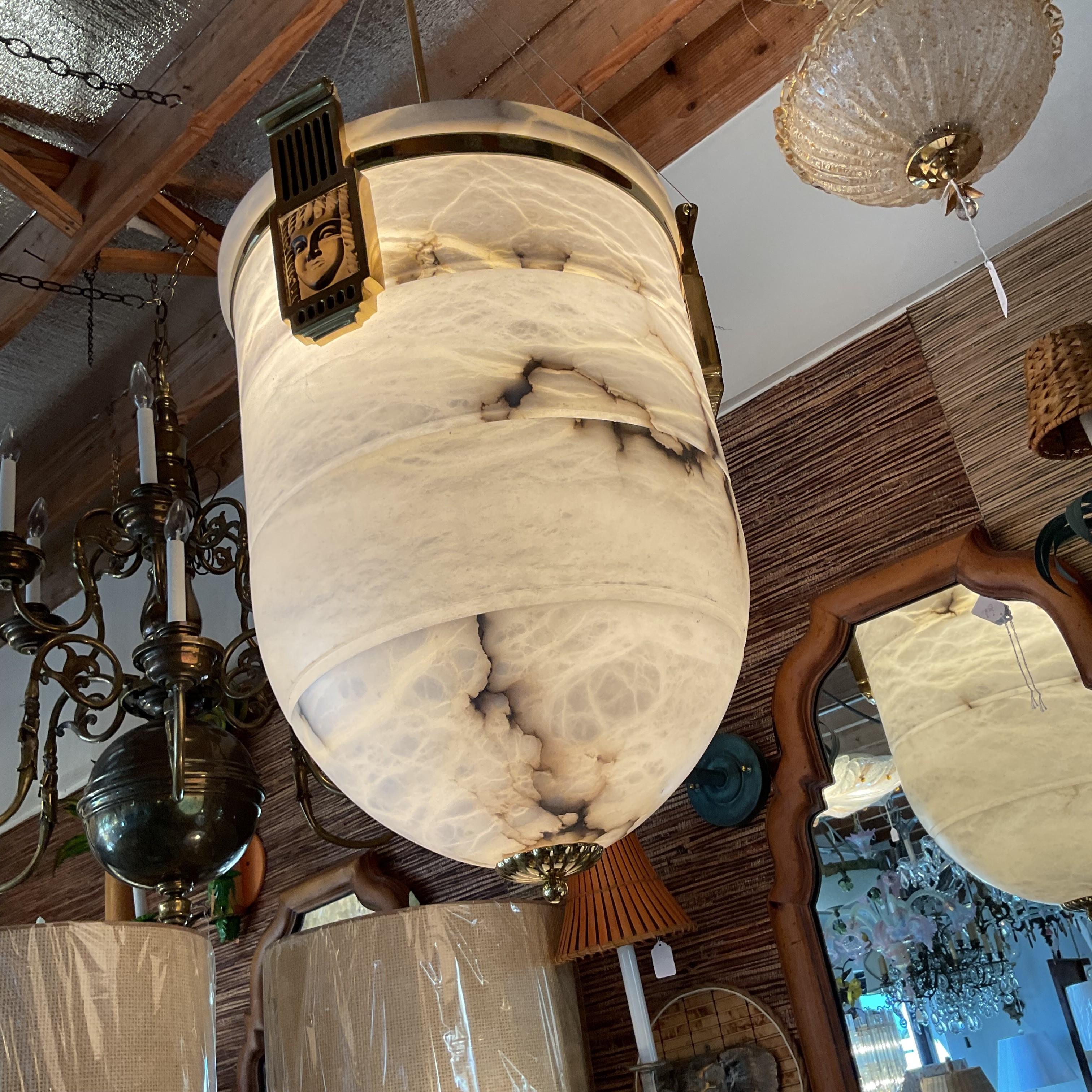 Please note- this fixture is huge and weighs about 200 lbs. It is going to need a very tall ceiling with a heavy duty support beam. There is also a picture of the canopy which is also made of alabaster. Again this is very large and very heavy. The