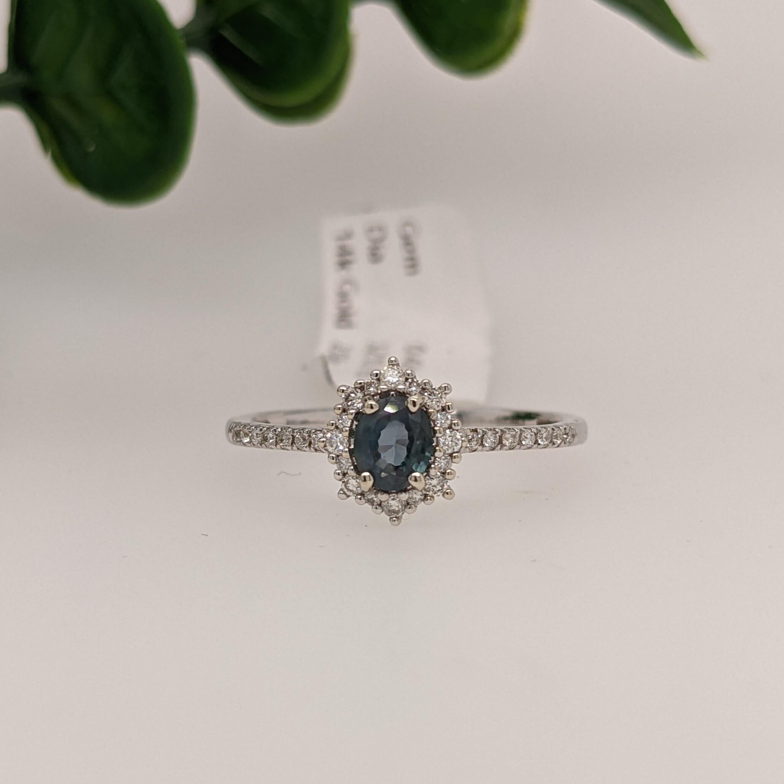 This beautiful ring features a unique natural color changing Alexandrite with natural earth-mined diamond accents in solid 14k white Gold. The color changing natural Alexandrite appears green/blue in daylight and shifts to a deep purple with red
