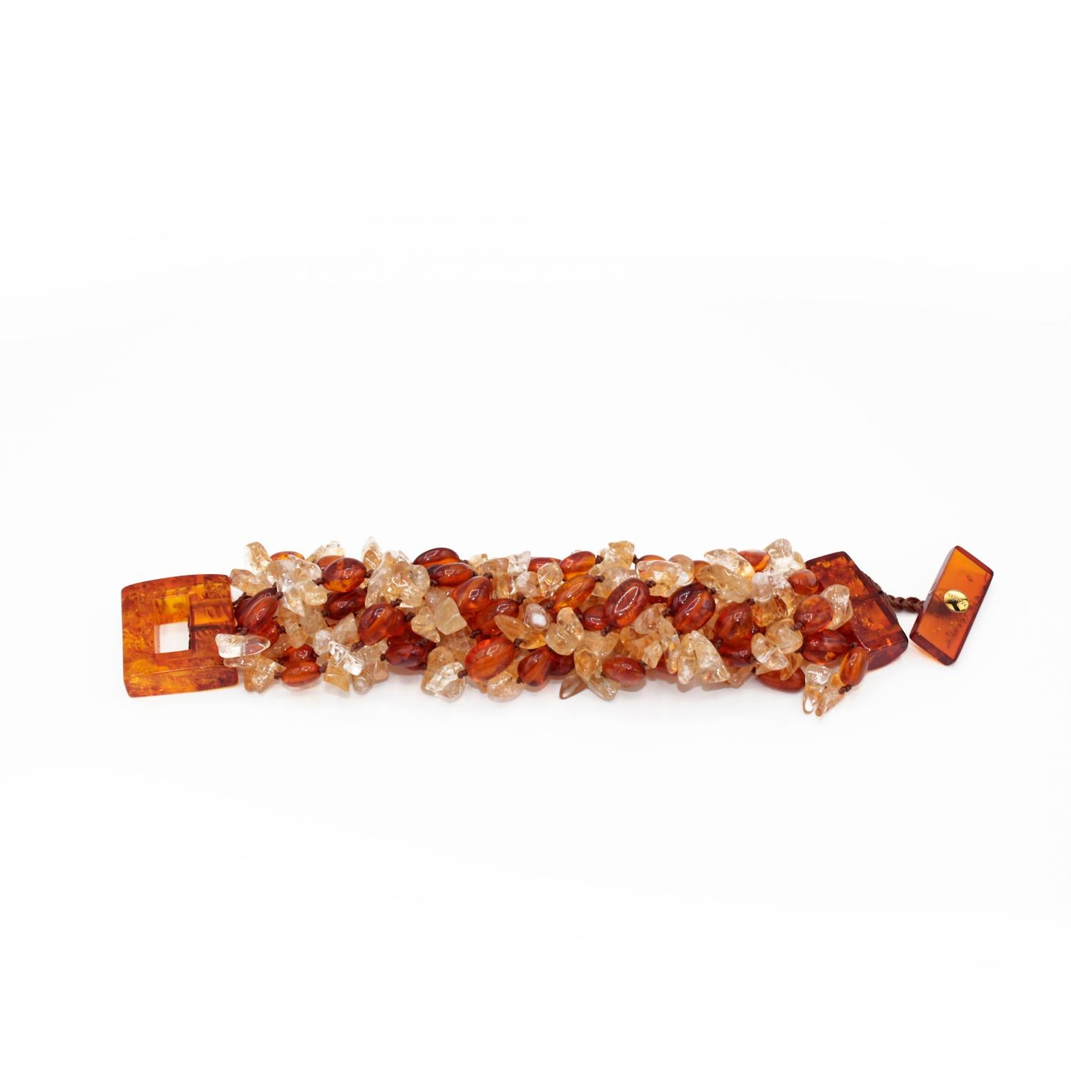 A nice multistring bracelet made up of natural amber and citrine ( 8 strands)
Natural amber clasp
Total lenght (including clasp) is cm 19 