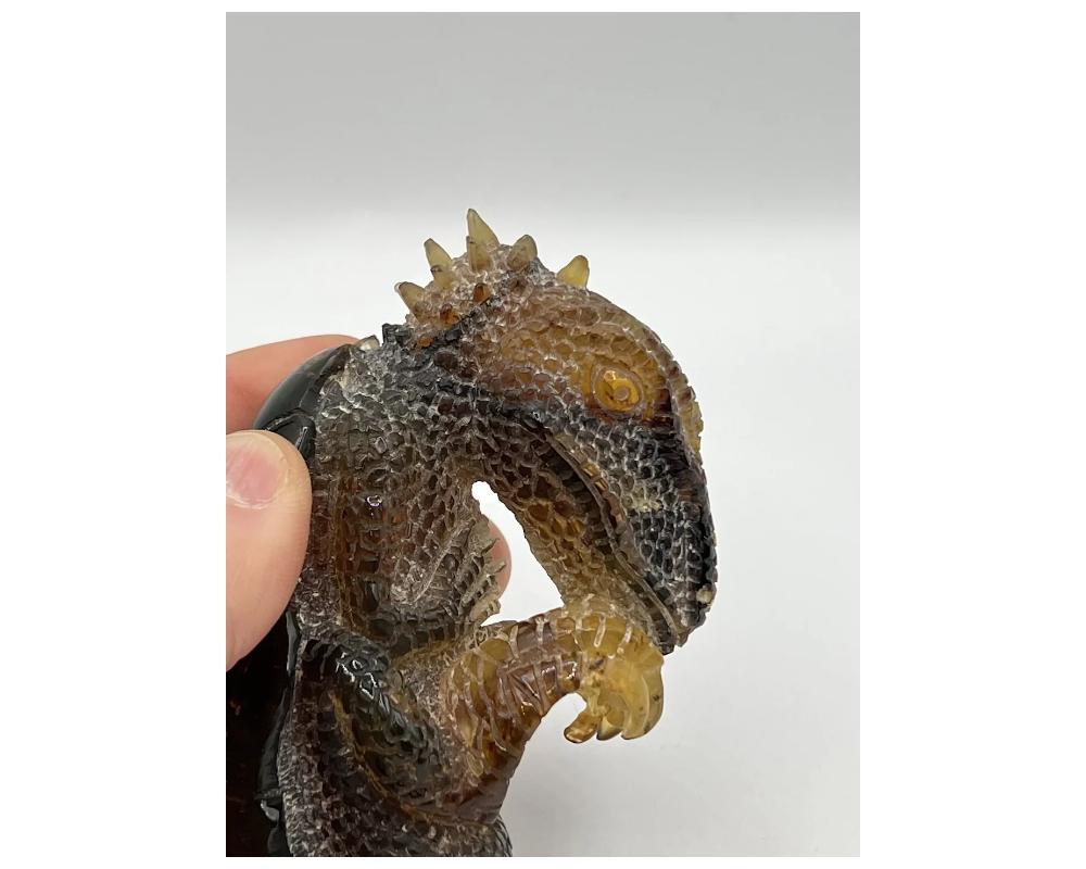 Unknown Natural Amber Hand Carved Figurine of a Dragon Dinosaur Egg