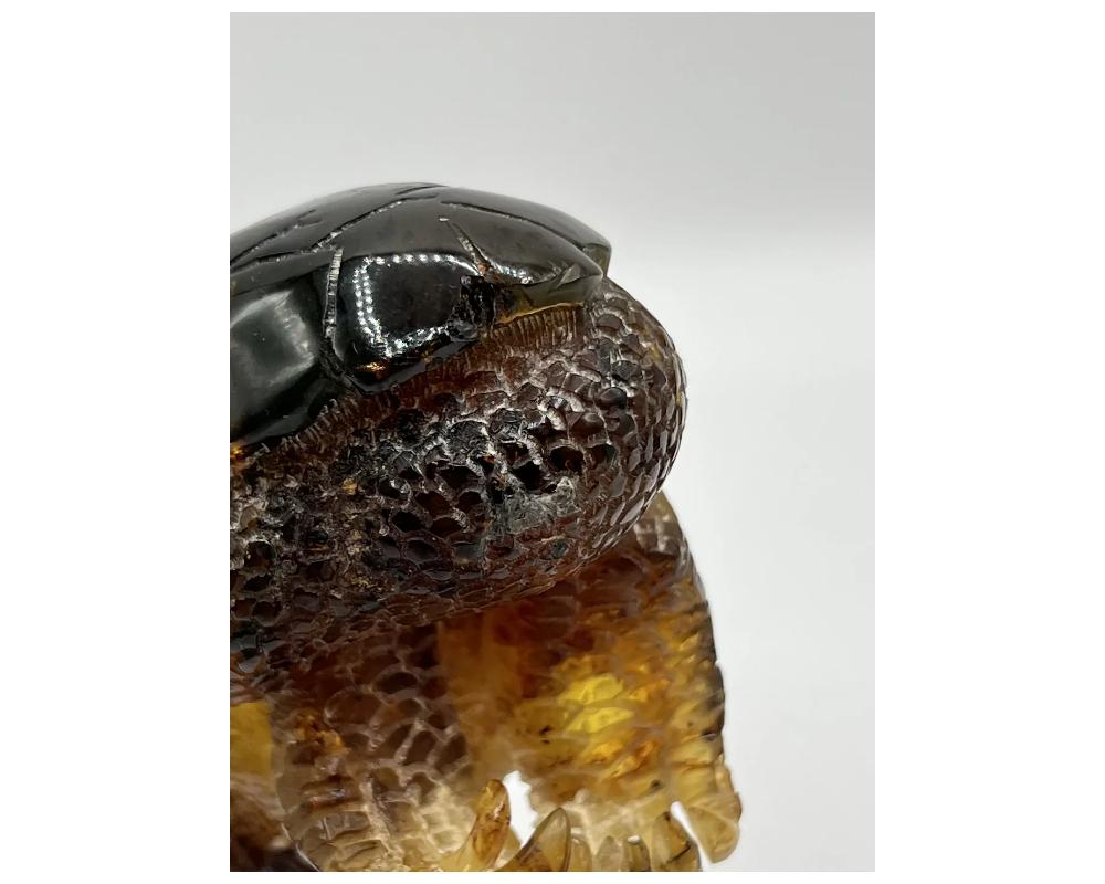 Hand-Carved Natural Amber Hand Carved Figurine of a Dragon Dinosaur Egg