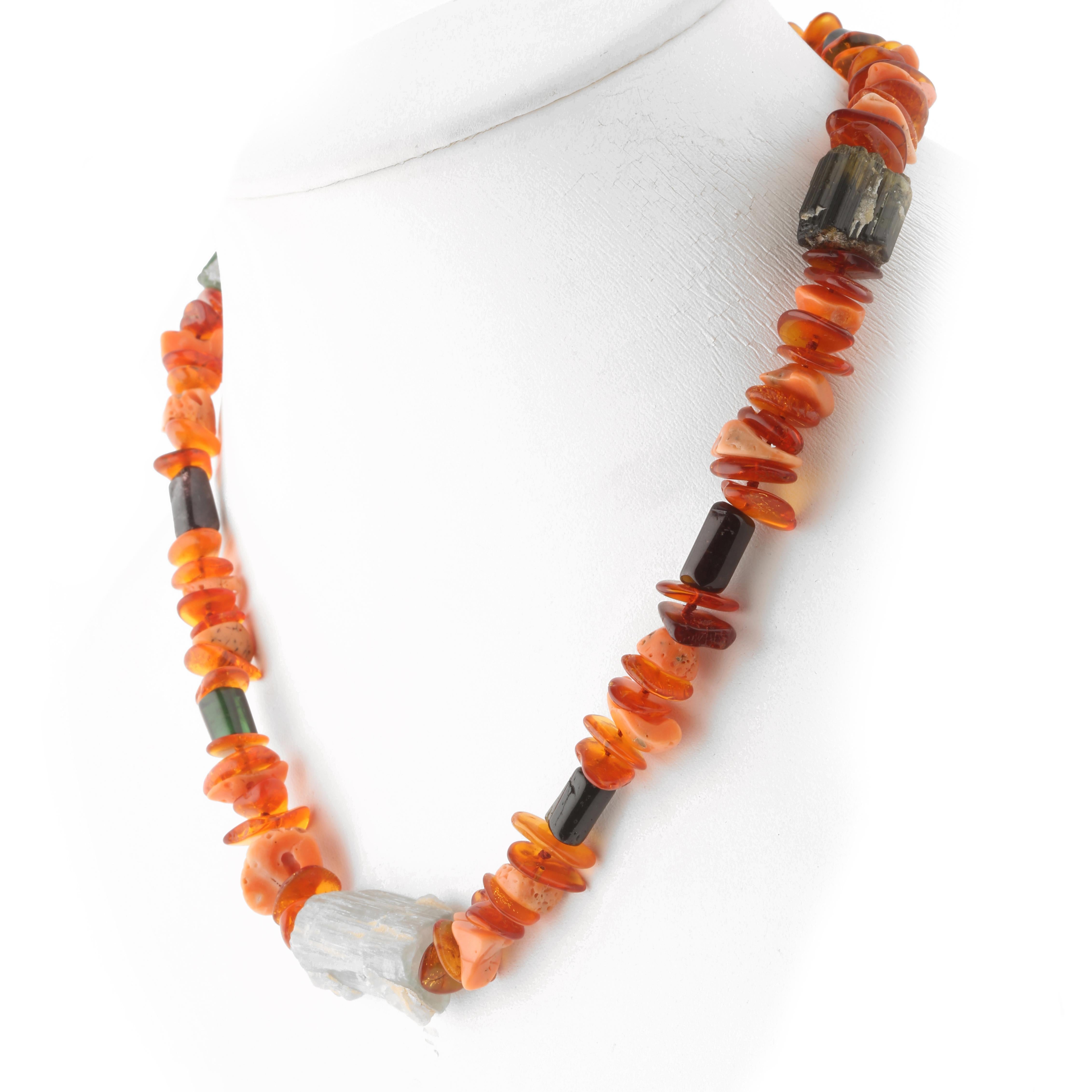 Autumn inspired necklace with raw stones of natural precious materials. Immerse yourself in the beauty of this uniquely designed necklace with natural stones full of life and color. 

Raw stones necklace with Amber and coral Chips, and raw uncut