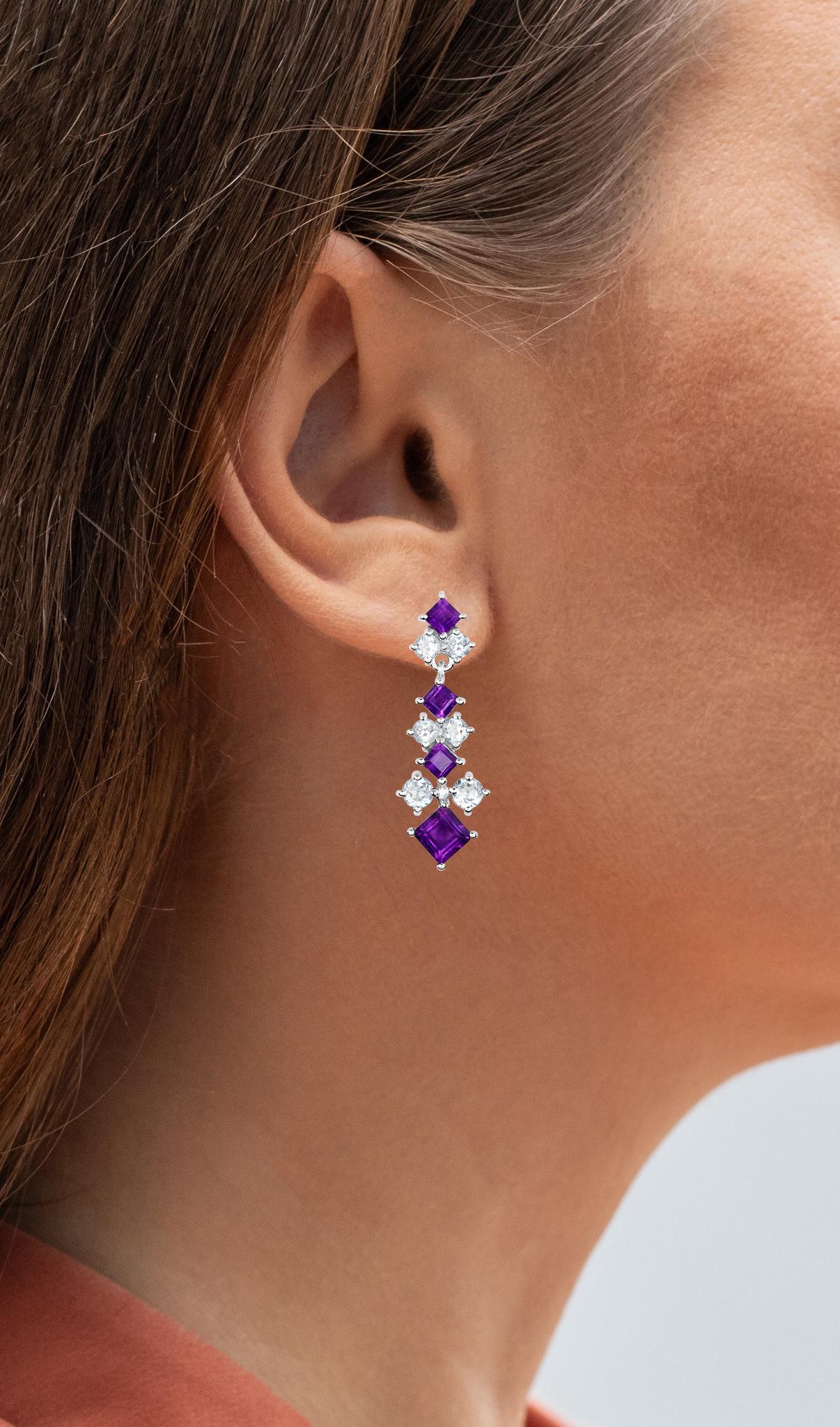 It comes with the Gemological Appraisal by GIA GG/AJP
All Gemstones are Natural
Gemstones: Amethysts, Blue Topazes
Total Carat Weight: 5.00 Carats
Cut = Mixed Cut
Total Quantity Of Stones: 20
Metal: Rhodium Plated Sterling Silver
Post With Friction