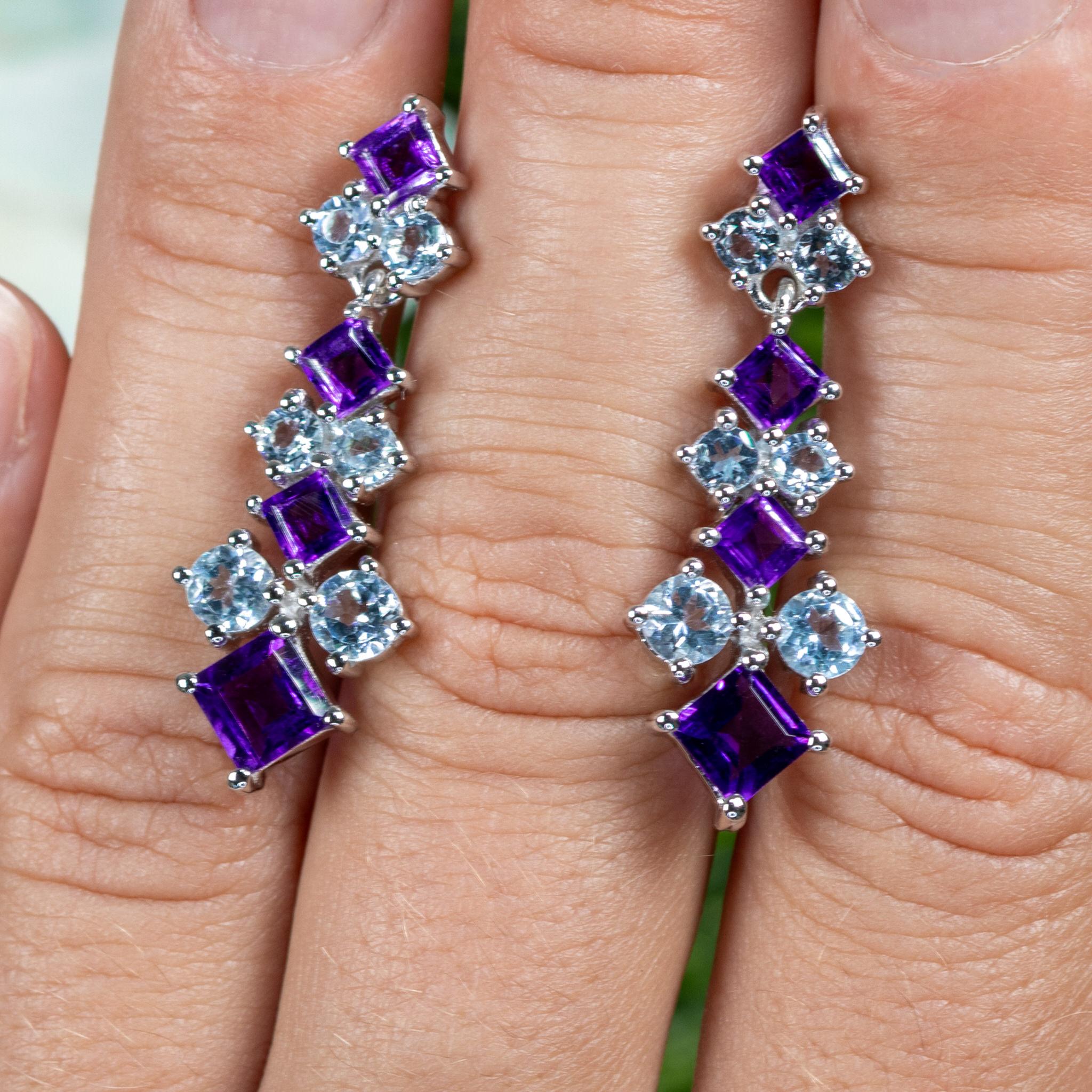 It comes with the Gemological Appraisal by GIA GG/AJP
All Gemstones are Natural
Gemstones: Amethysts, Blue Topazes
Total Carat Weight: 5.00 Carats
Cut = Mixed Cut
Total Quantity Of Stones: 20
Metal: Rhodium Plated Sterling Silver
Post With Friction