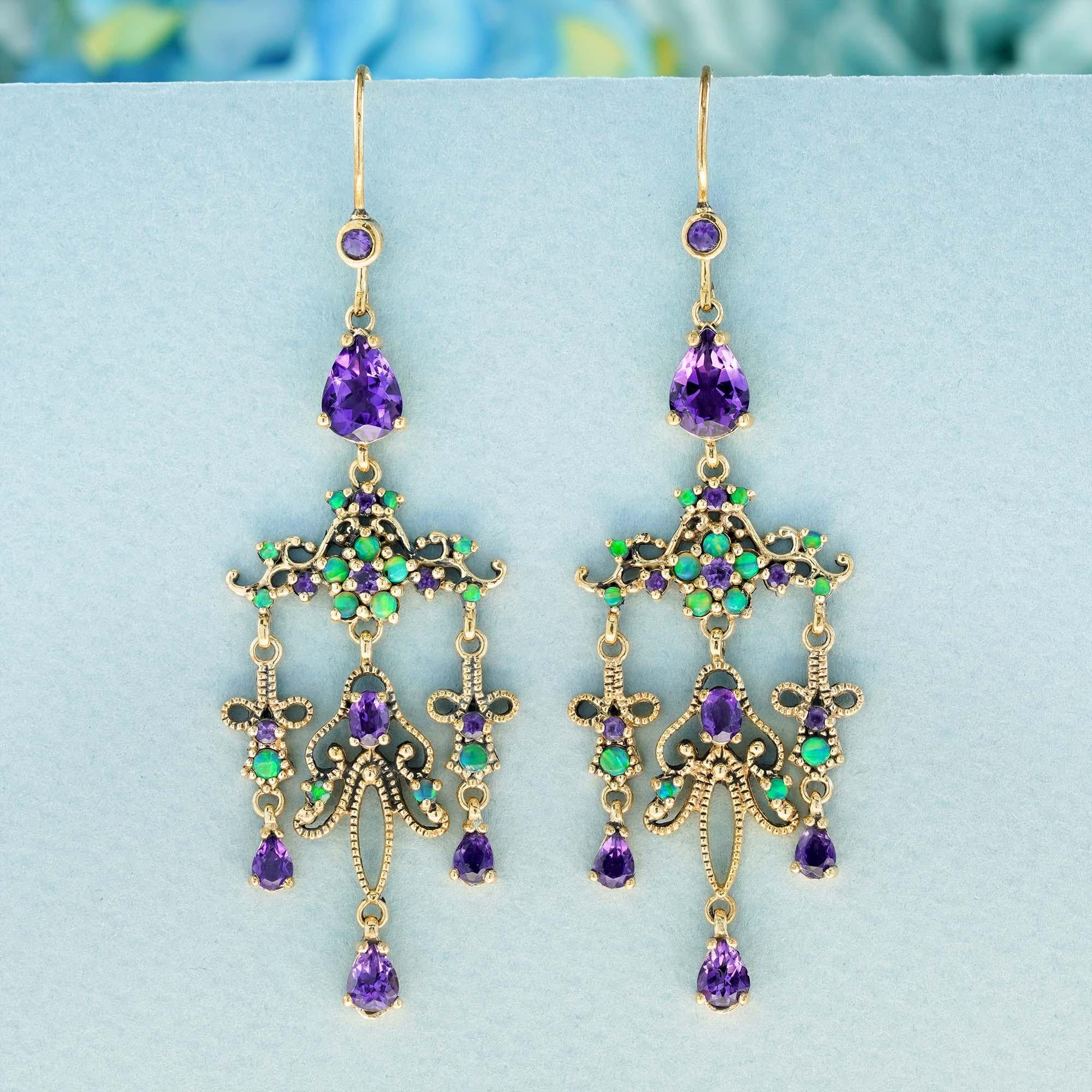 Crafted in yellow milgrained gold, these 4.9 carat vintage-inspired chandelier earrings in a style reminiscent of the Art Deco and Edwardian eras. They feature a cascade of gemstones in shades of purple and green, suspended from the gold hooks