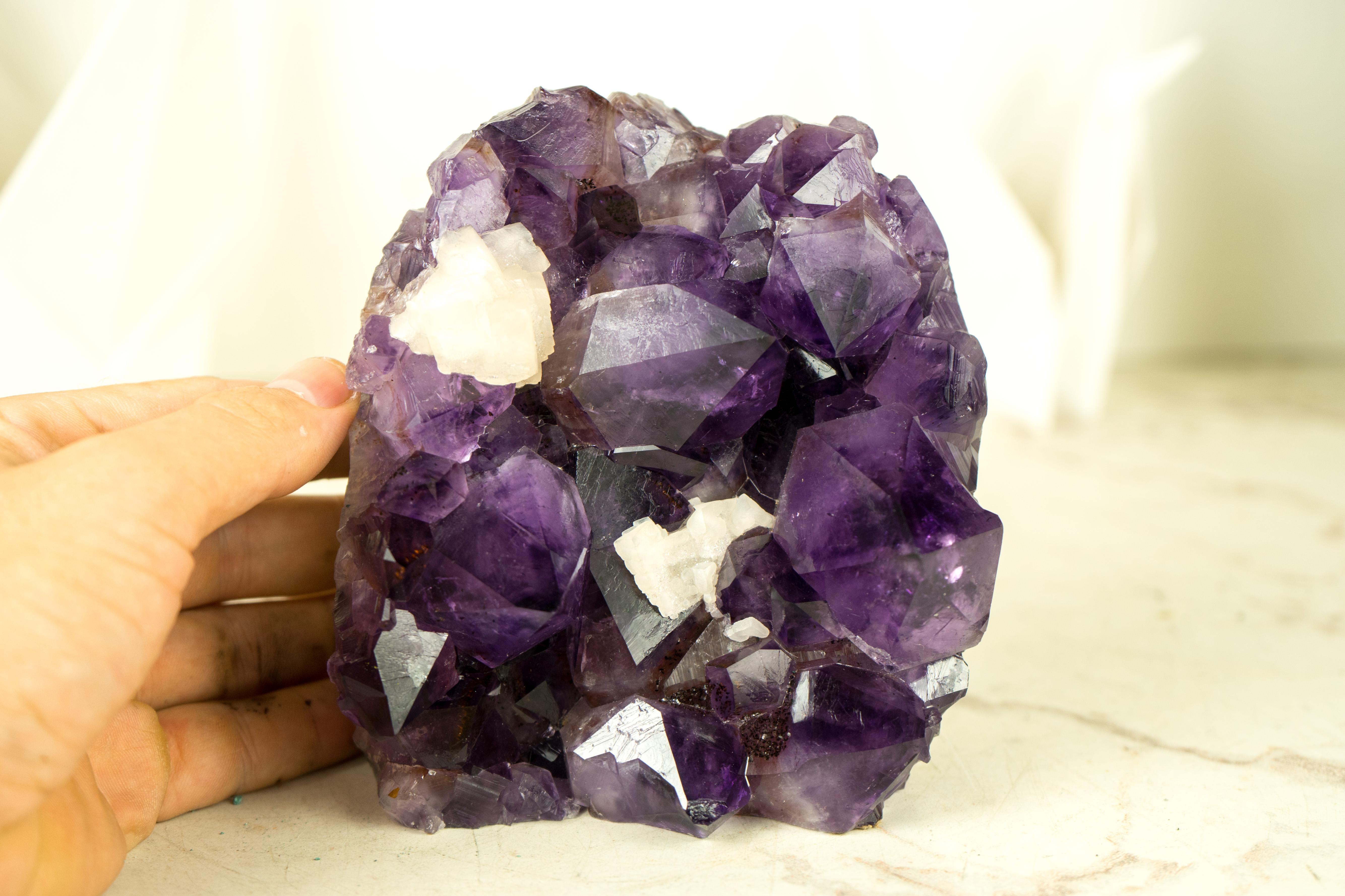 High-Grade Amethyst Geode Cluster with sparkly, Large AAA-Grade Amethyst Points

▫️ Description

An extraordinary Amethyst Cluster from Brazil that possesses world-class characteristics. Its deep, rich purple tone brings beauty and elegance, making