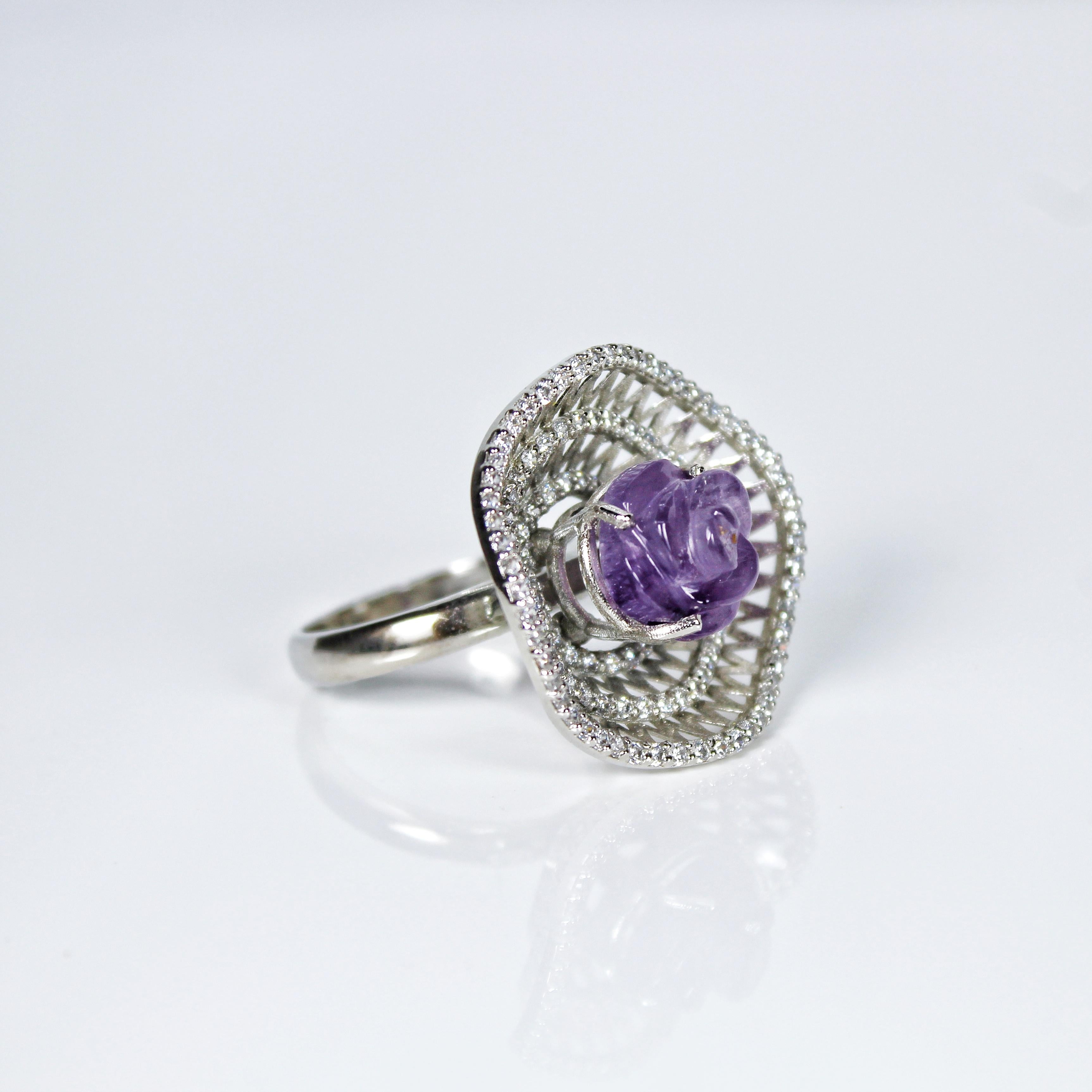 Metal - Silver
Indian ring size - 17
Product gross Weight - 8.450 Grams
Gemstone - Natural Amethyst
Total stone weight - 5.5 Carat
Stone shape - Rose
Stone size - 11 x 11 mm
Diamonds - Swarovski

The center of the cocktail ring is adorned with a