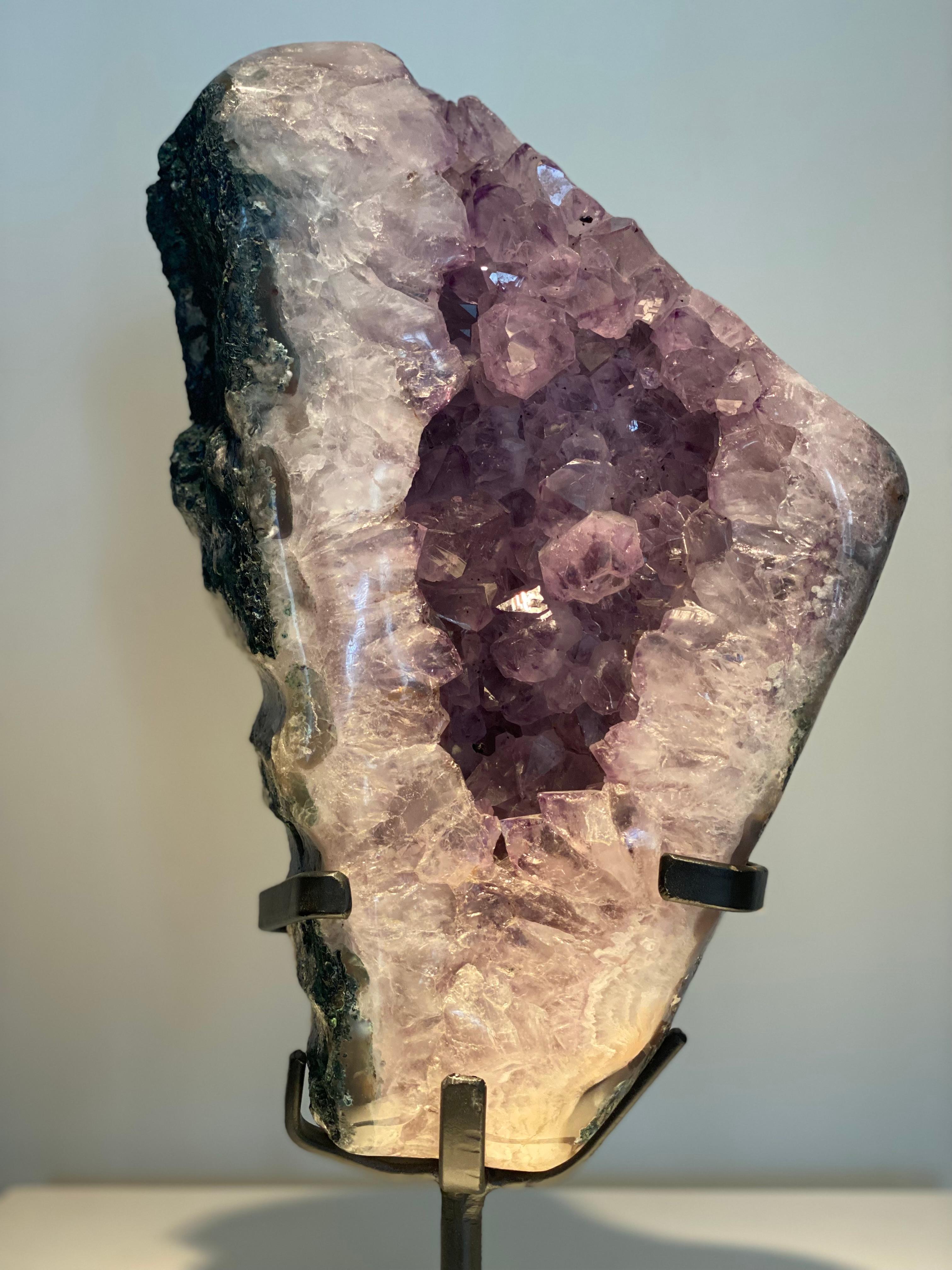 An Natural Amethyst Geode Cluster from Brazil,
beautiful deep color,
correct shine and patina, mounted on an iron base