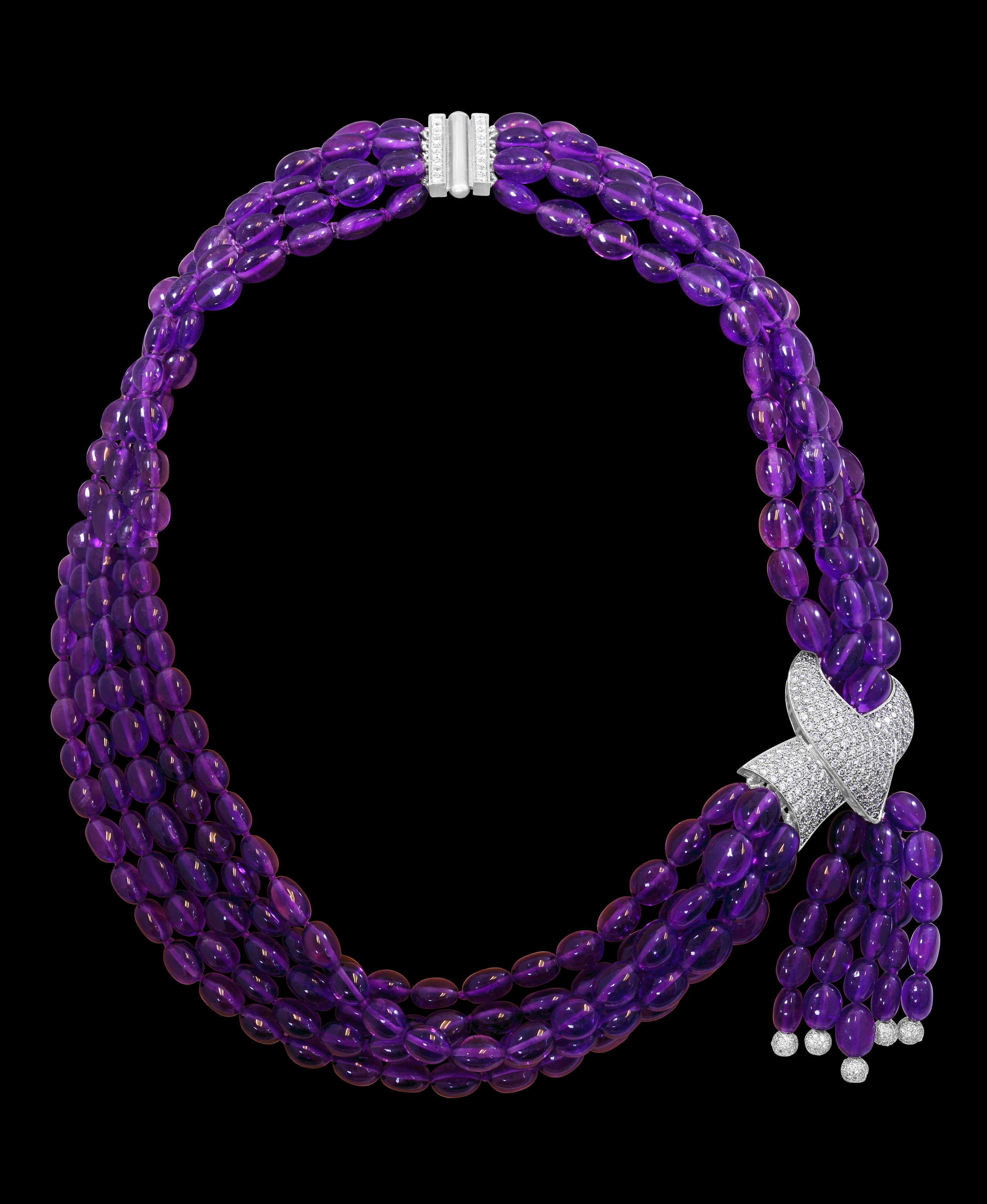  Natural Amethyst  Multi Layer Bead Necklace In Platinum  With  9 Carats of  fine Quality Diamonds
5 layers of Natural Amethyst  Beads
Beautiful intense color 
All made in Platinum
Beautful dimaond clasp too in Platinum
All our jewelry comes with a
