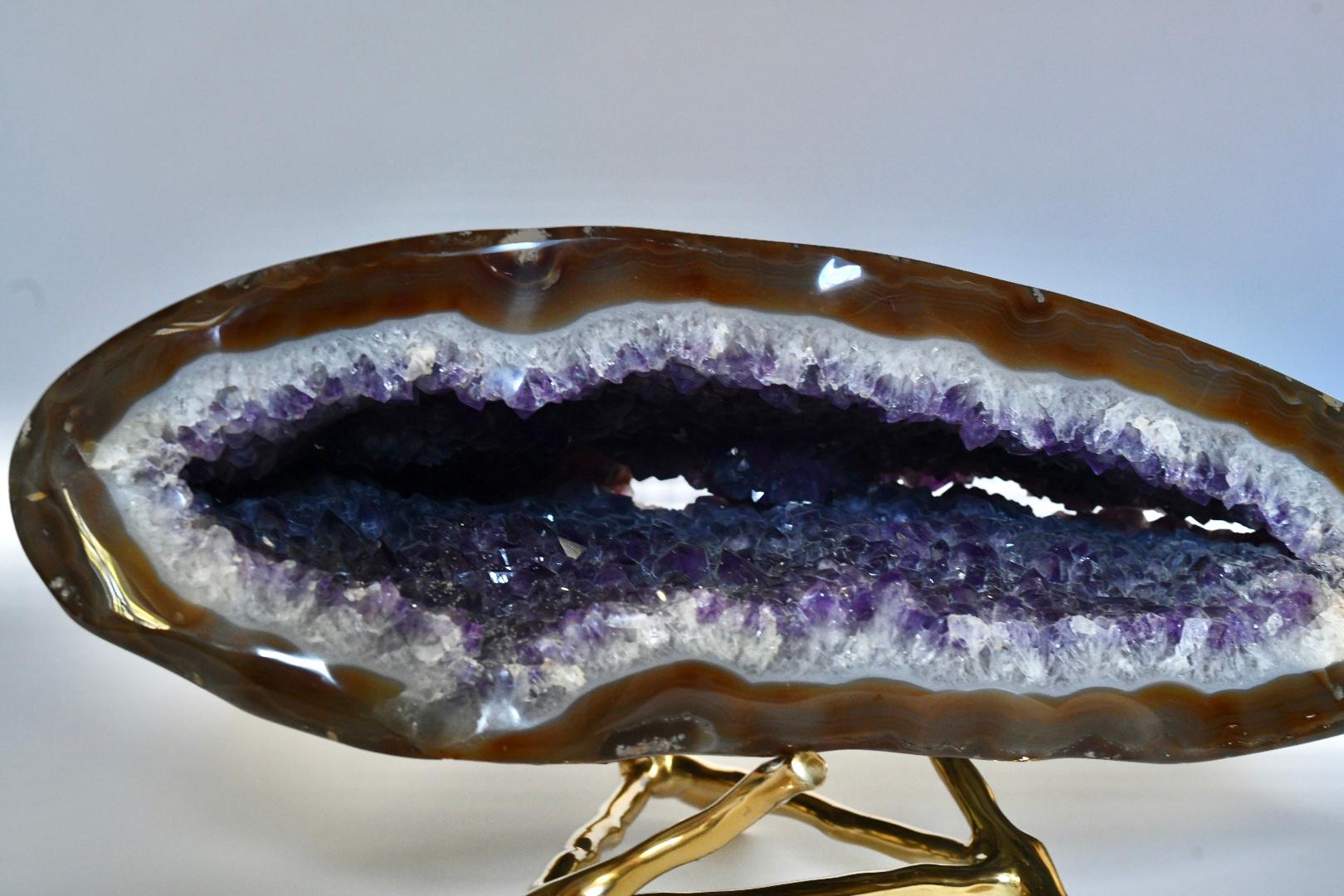 Natural amethyst sculpture on a stand. 

Dimensions of amethyst itself: 17.5