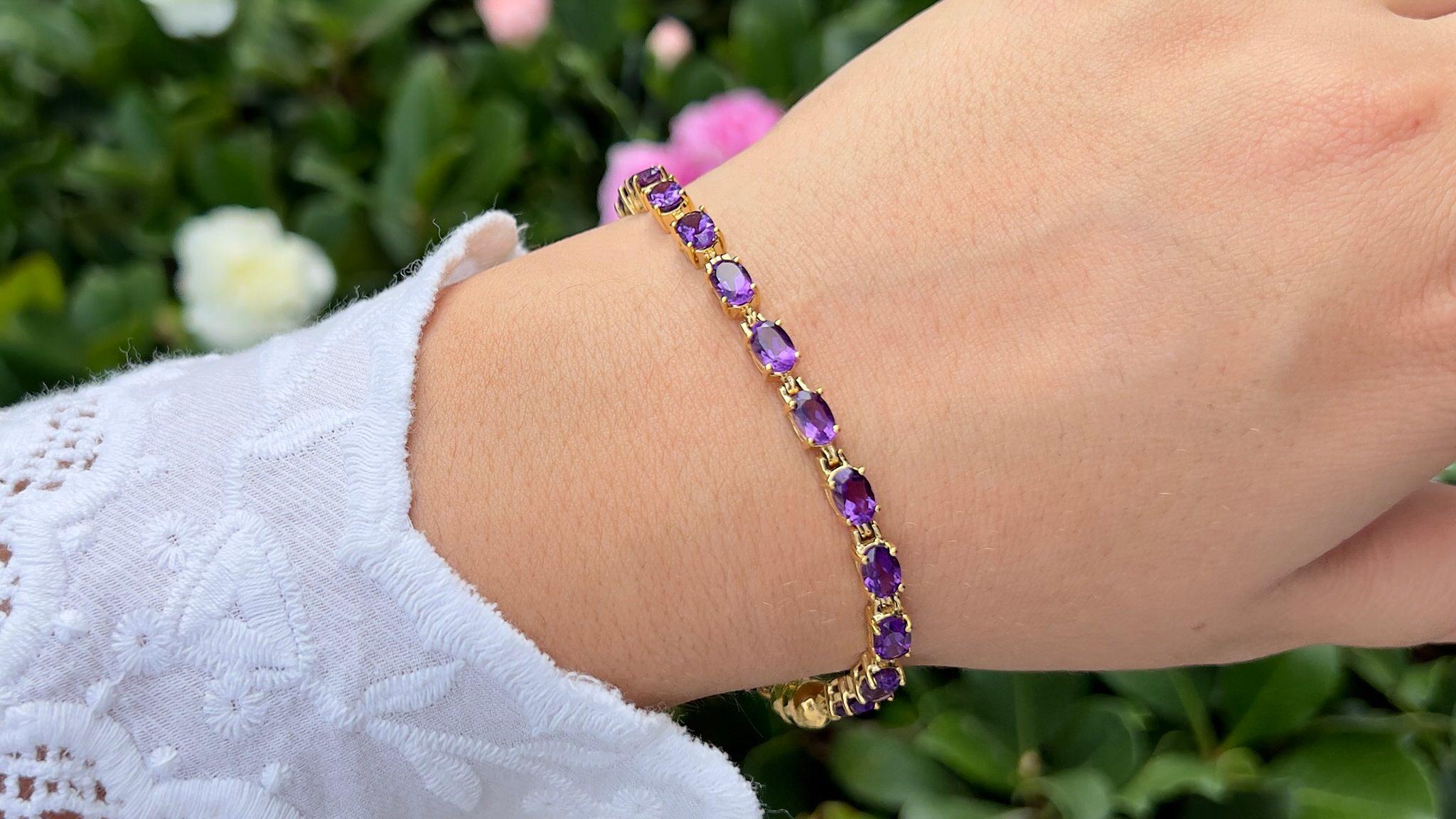 It comes with the appraisal by GIA GG/AJP
All Gemstones are Natural 
20 Oval Cut Amethysts = 8.40 Carats
Metal: 18K Yellow Gold Plated Silver
Bracelet Length: 7 Inches
Magnetic Clasp