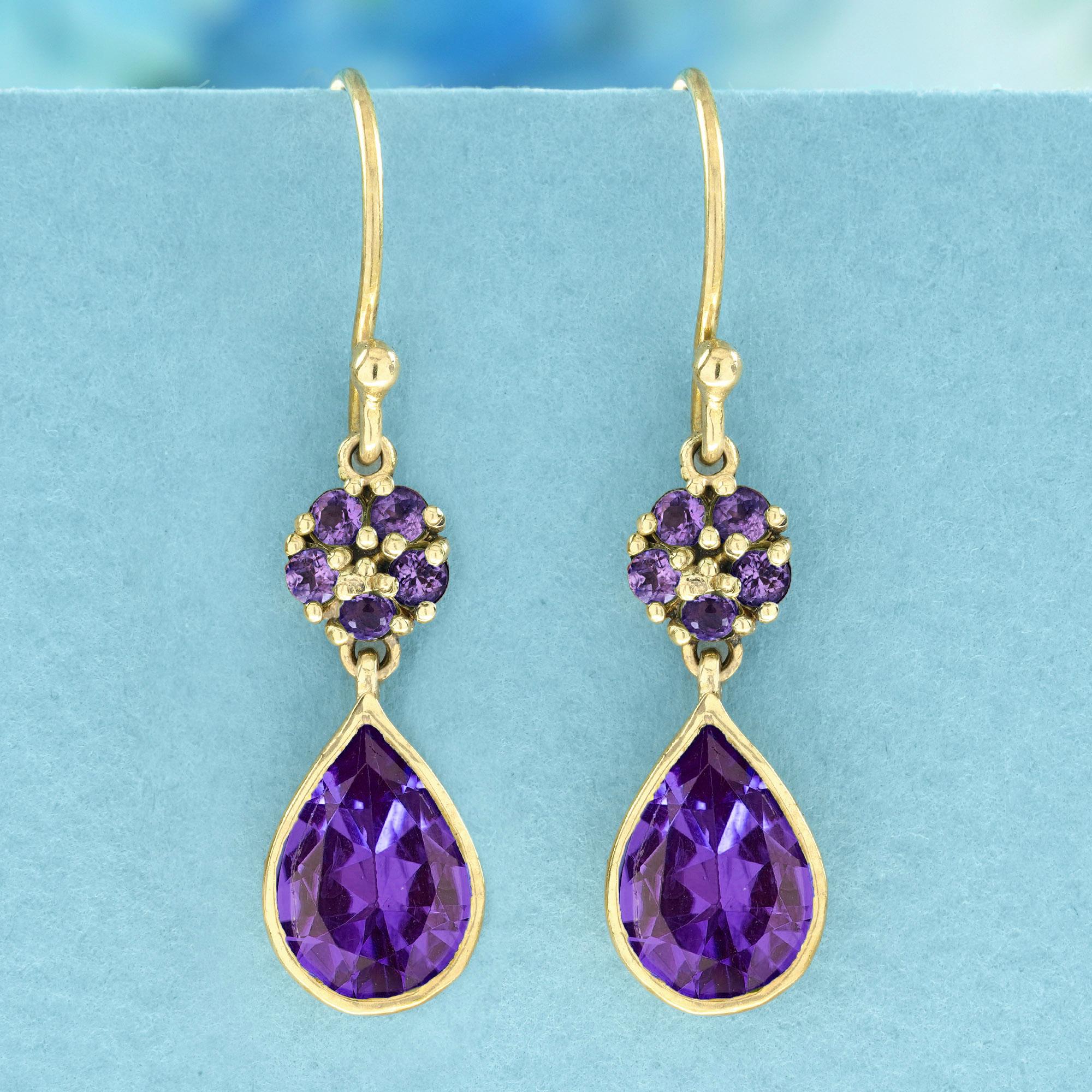 Elevate your accessory game with our Natural Amethyst Vintage Style Drop Earrings in 9K Yellow Gold. These stunning earrings feature a beautifully crafted prong-set amethyst cluster, delicately perched above an elegant amethyst drop. The vintage
