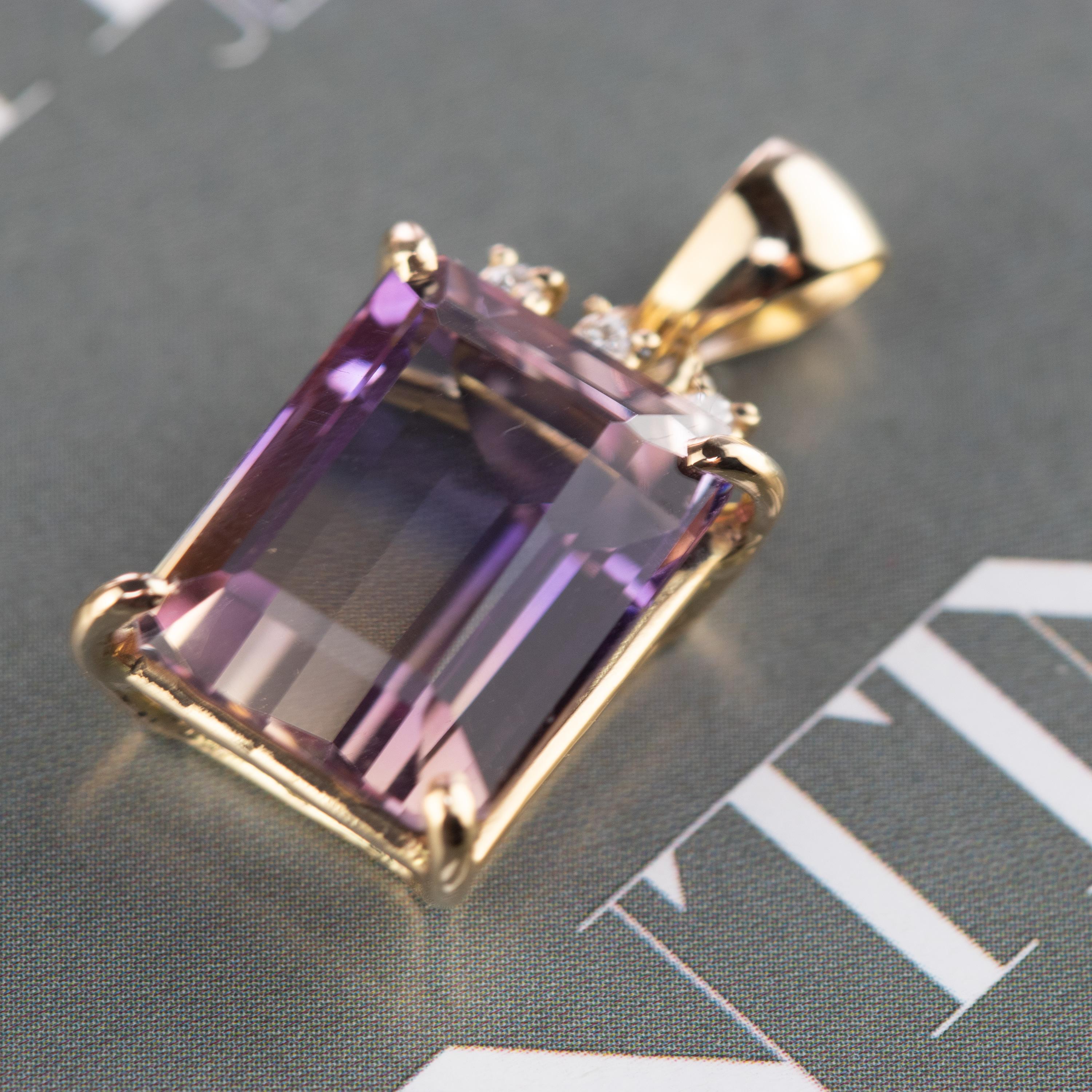 Stunning unique piece of Ametrine pendant enhanced by 3 brilliant diamonds on top inspired by the Victorian royalty look. Design decorated by 18 karat yellow gold. A vintage accessory ready to be part of a stunning outfit.

Ametrine, also known as