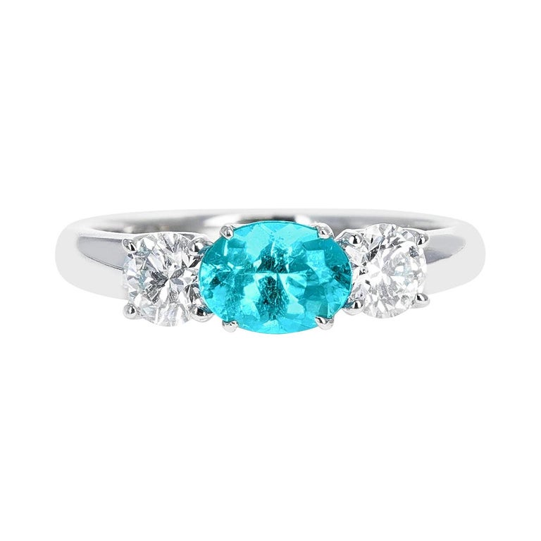 Natural and Certified Brazilian Paraiba Tourmaline and Diamond Three-Stone Ring For Sale
