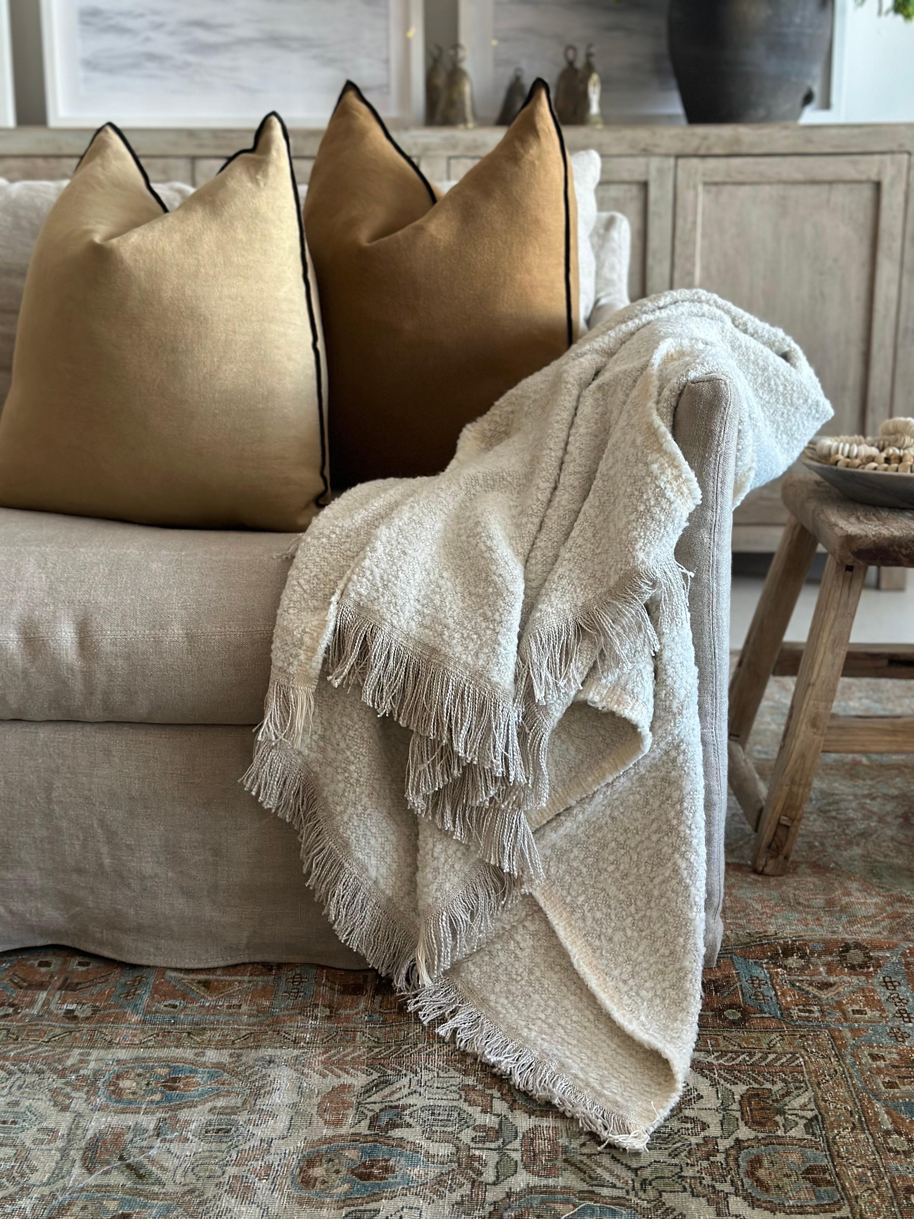 Woven in Belgium using traditional weaving techniques, Bloom Home Inc throw features a combination of smooth Belgian Linen and woolly Alpaca. This blanket combines a fluffy boucle wool with a silky soft viscose/linen.

Color: Natural &