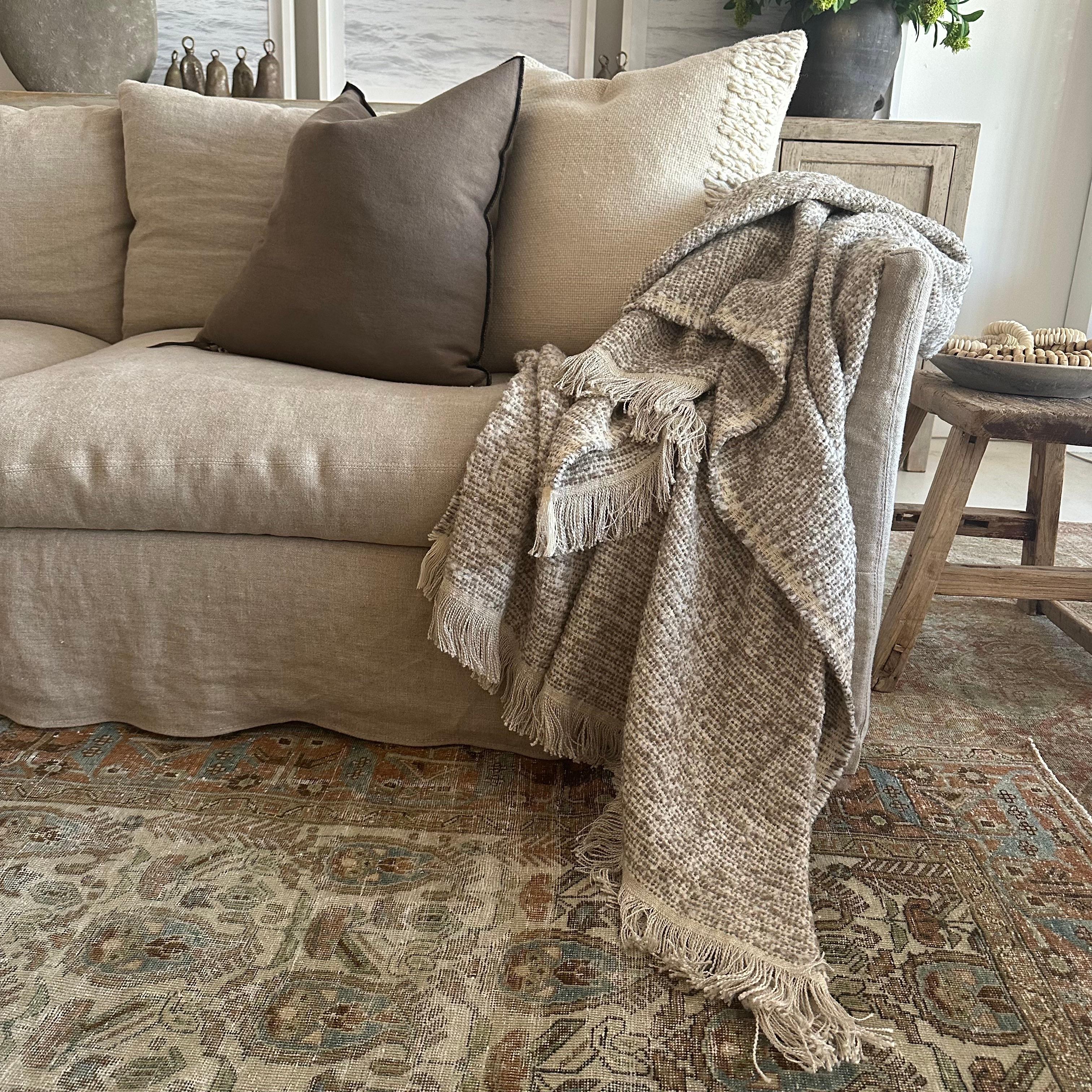 Woven in Belgium using traditional weaving techniques, Bloom Home Inc throw features a combination of smooth Belgian Linen and woolly Alpaca. This blanket combines a fluffy boucle wool with a silky soft viscose/linen.

Color: Natural & Mink
Content: