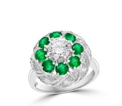 Anello vittoriano antico con smeraldo naturale e diamante solitario in platino