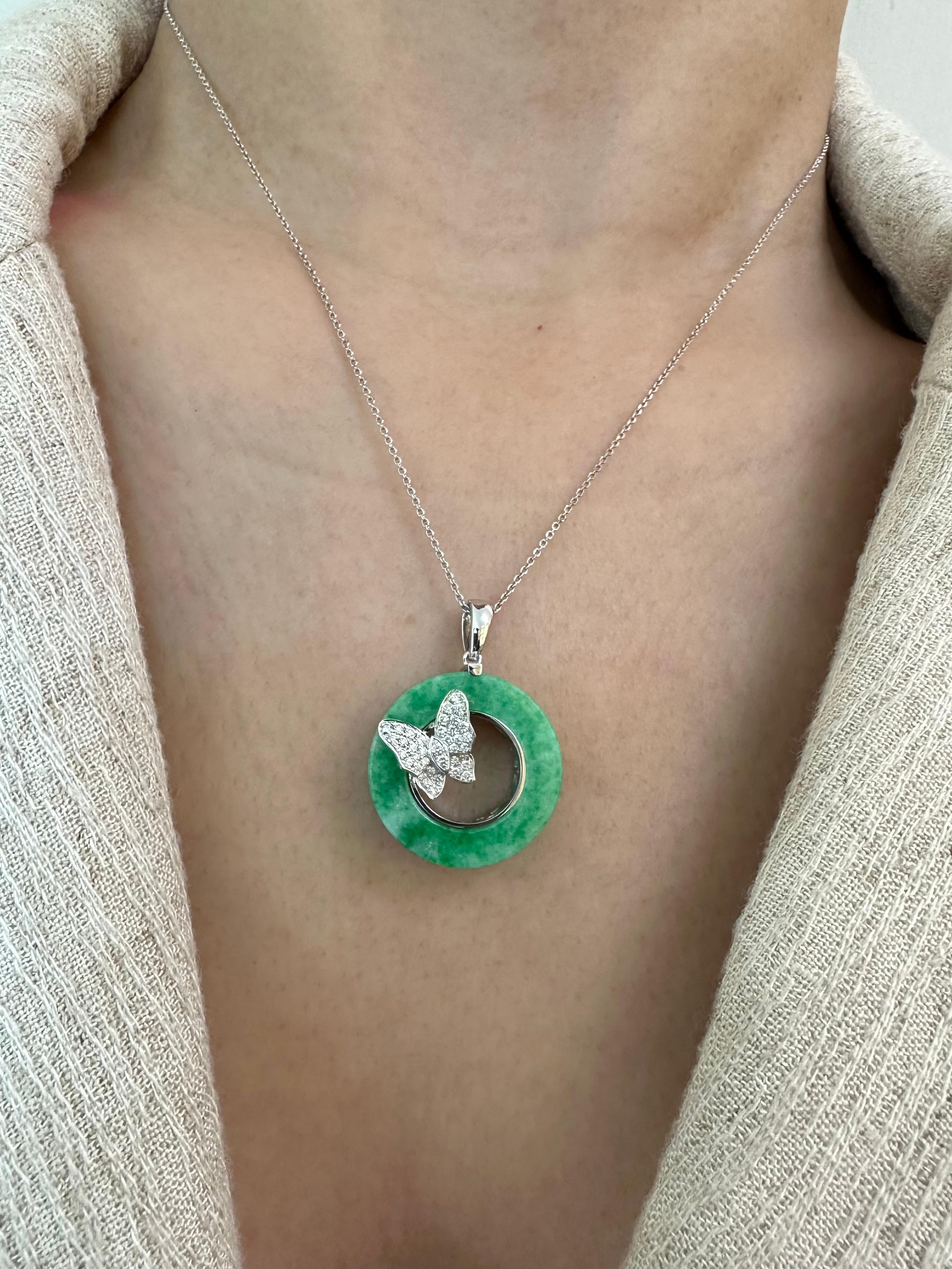Please check out the HD video. This apple green jadeite jade diamond butterfly pendant (there is a matching ring, please check out our other listing) is well designed and very eye pleasing. The design is as beautiful in the back as it is in the