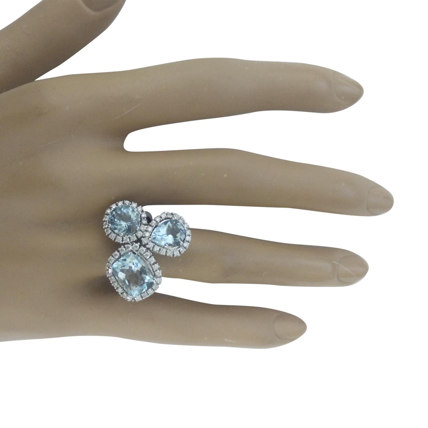 4.98 Carat Natural Aquamarine 14 Karat Solid White Gold Diamond Ring
Stamped: 14K
Total Ring Weight: 8.9 Grams 
Aquamarine Weight: 4.38 Carat  
Quantity: 3
Shape: Cushion, Round, Pear
Diamond Weight: 0.60 Carat (F-G Color, VS2-SI1 Clarity