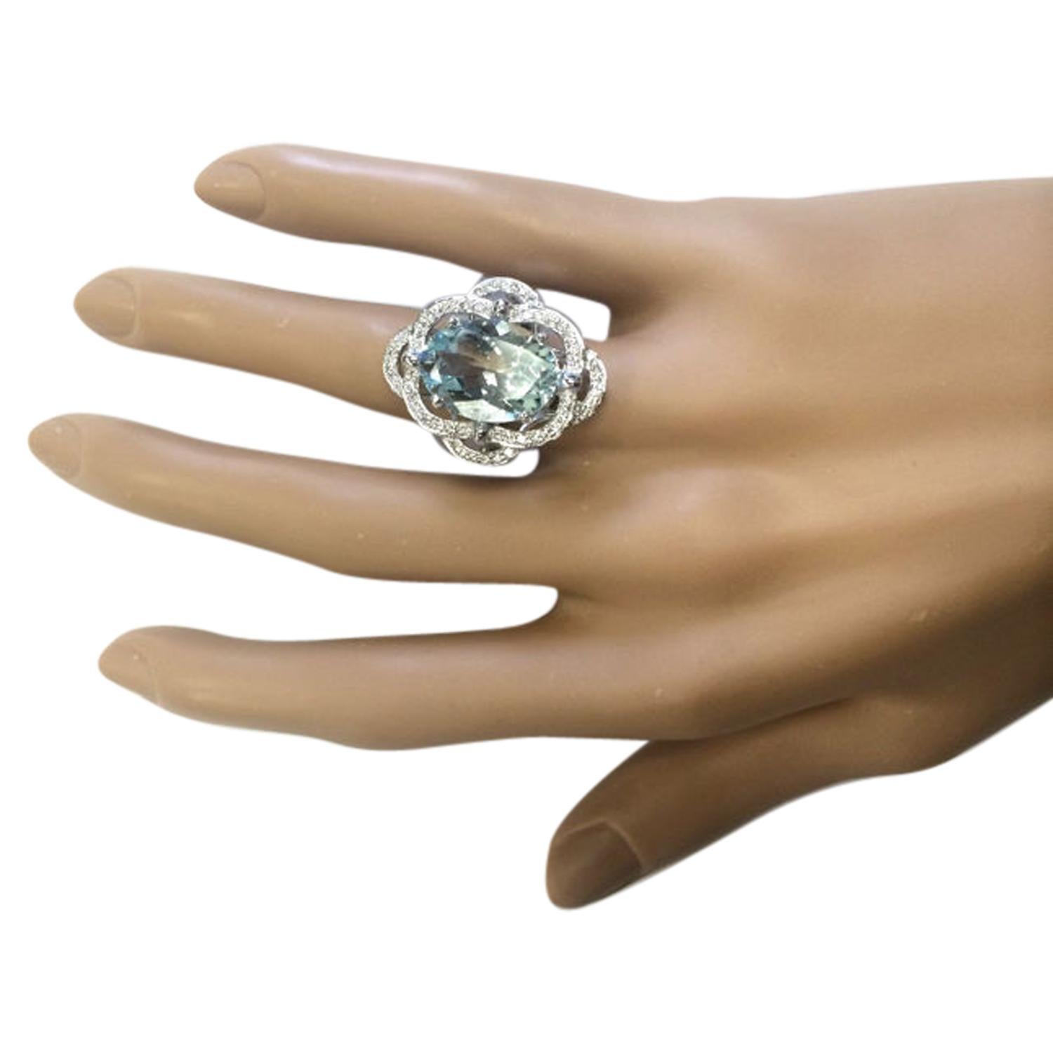 6.97 Carat Natural Aquamarine 14 Karat Solid White Gold Diamond Ring
Stamped: 14K 
Total Ring Weight: 7.3 Grams 
Aquamarine Weight: 6.57 Carat (15.00x11.00 Millimeters)  
Diamond Weight: 0.40 Carat (F-G Color, VS2-SI1 Clarity)
Quantity: 64
Face