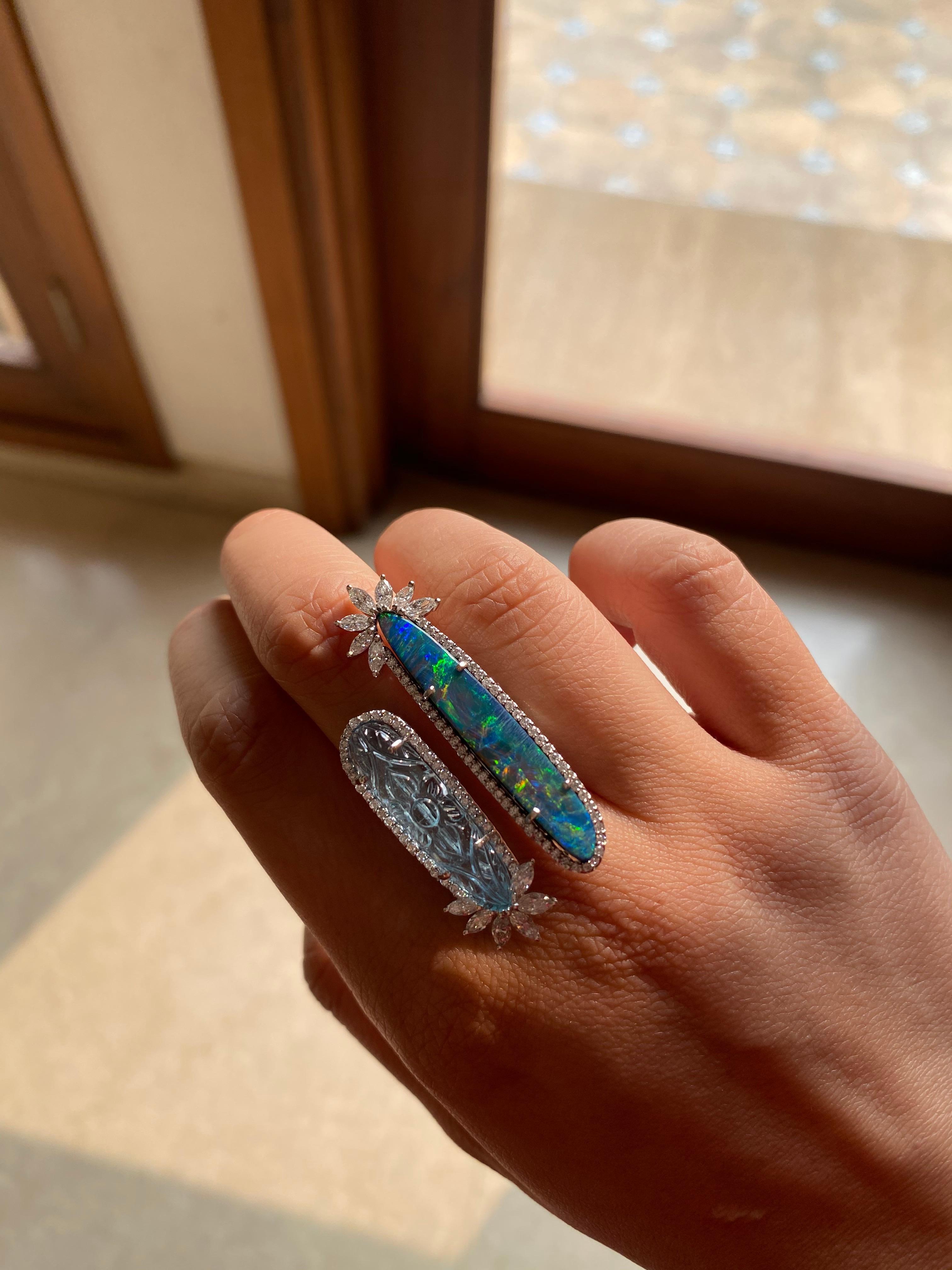 A modern and chic Aquamarine and Australian Opal Doublet ring set in 18k white god . The aquamarine weight 7.15 carats and opal weight is 5.99 carats . the diamond weight is 1.44 carats. The ring dimensions in cm 4.2 x 2.2 x 2.4 (LXWXH). US 6