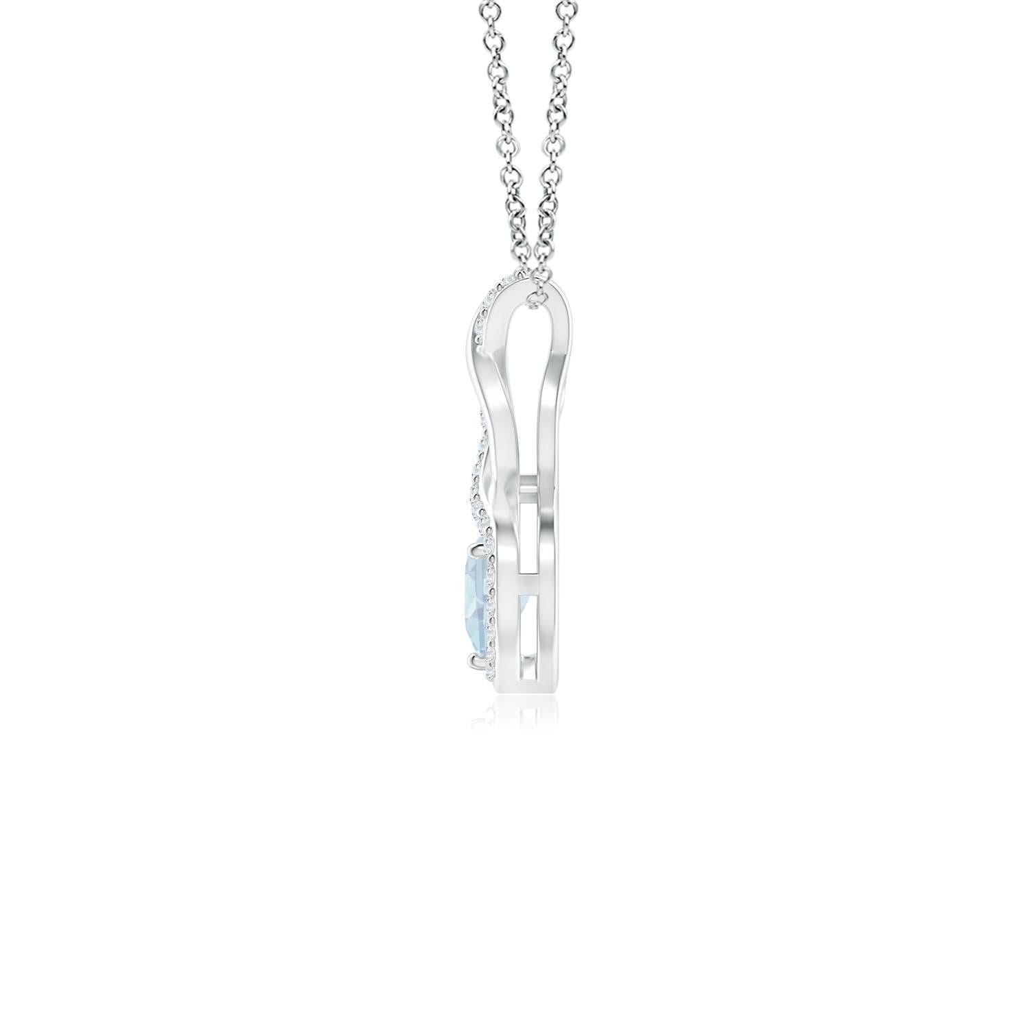 A diamond studded strip entwines with a lustrous metal strip to form an ornate infinity. Floating amid the graceful infinity is an icy blue heart-shaped aquamarine in a prong setting. The sparkling diamonds infuse a captivating edge to this platinum