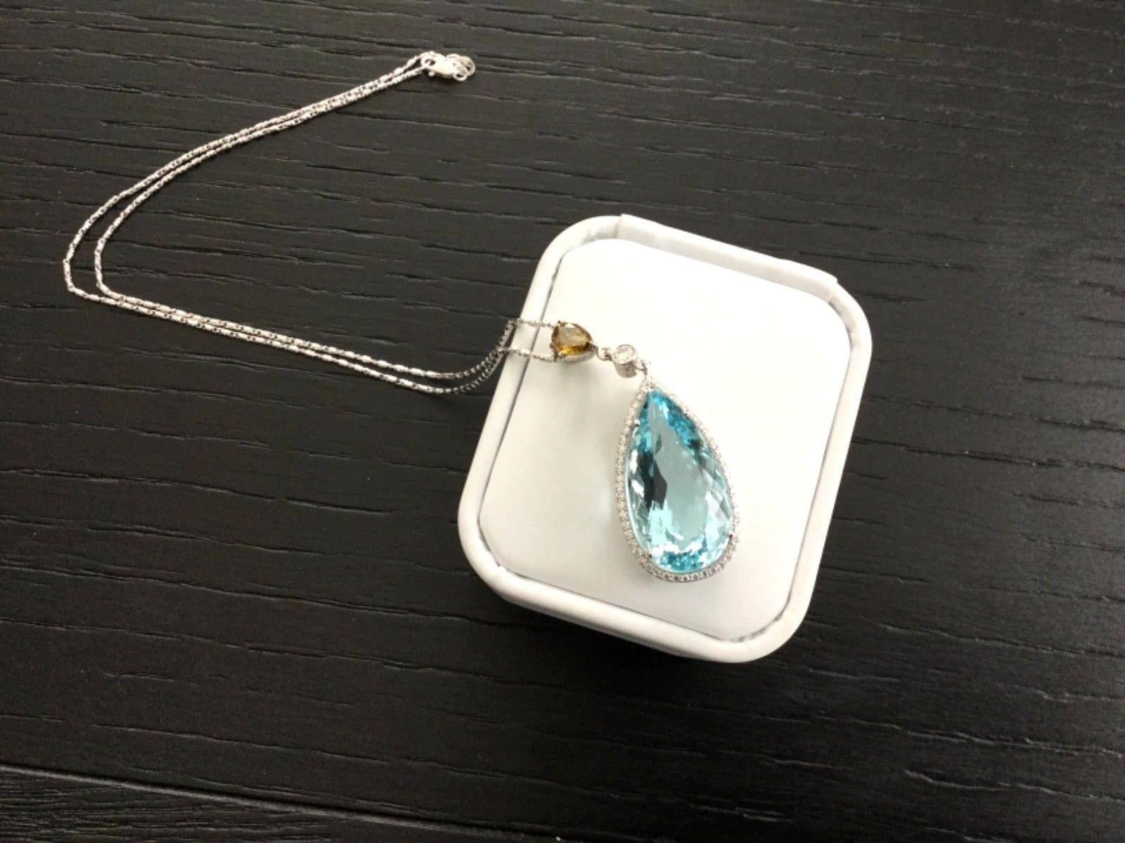 FEBRUARY MARCH SPECIAL - MARKED DOWN $1000! To $6995!

For your consideration is a 17.19 carat pear shaped, natural, transparent, greenish blue aquamarine set in a brand new 14k white gold setting with approximately .20 carats of natural G color VS