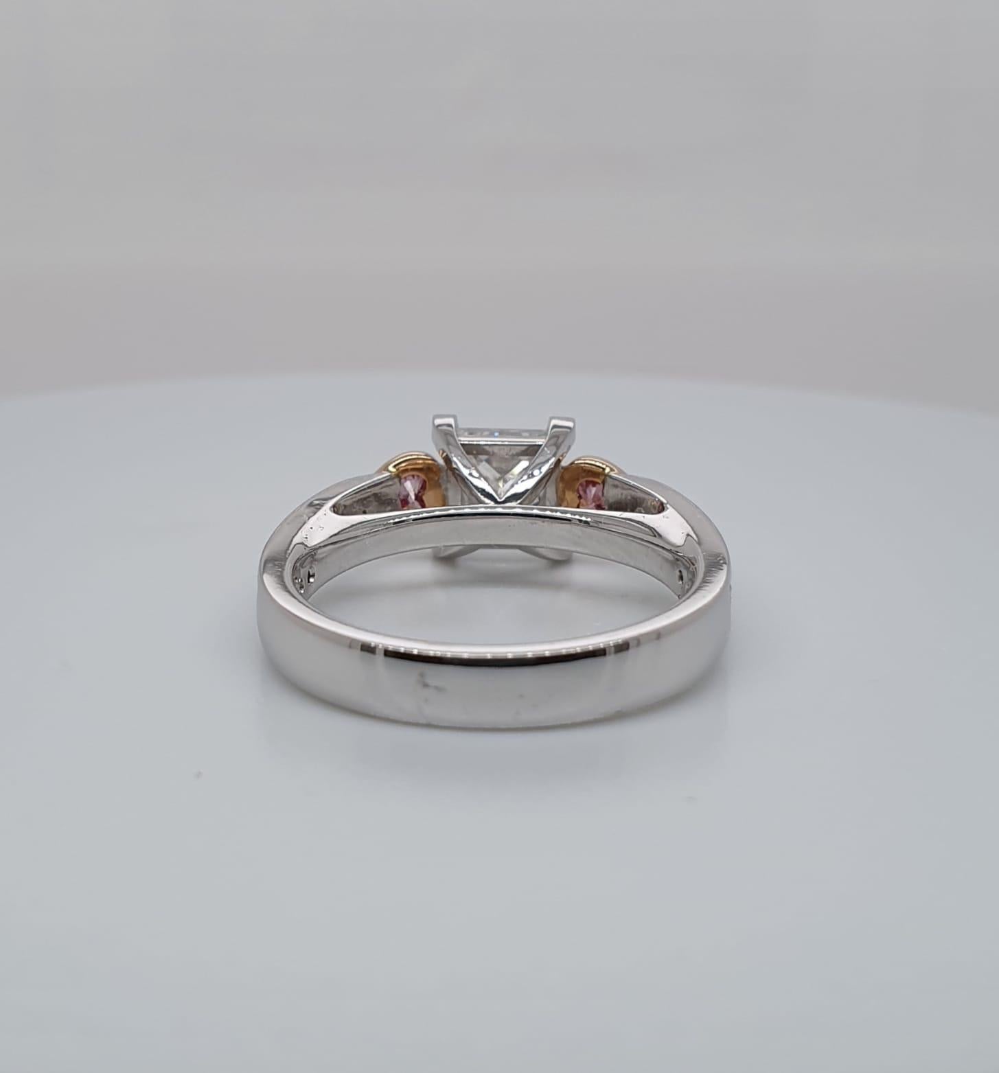 Totally unique, this handmade “Love Ring” is set with a very fine princess cut diamond weighing 1.01ct EVS2 XX and supported by 2 heart shaped Argyle pinks 2 = 0.13ct. The band is also channel set with 14 princess cut diamonds totalling 0.48cts. 