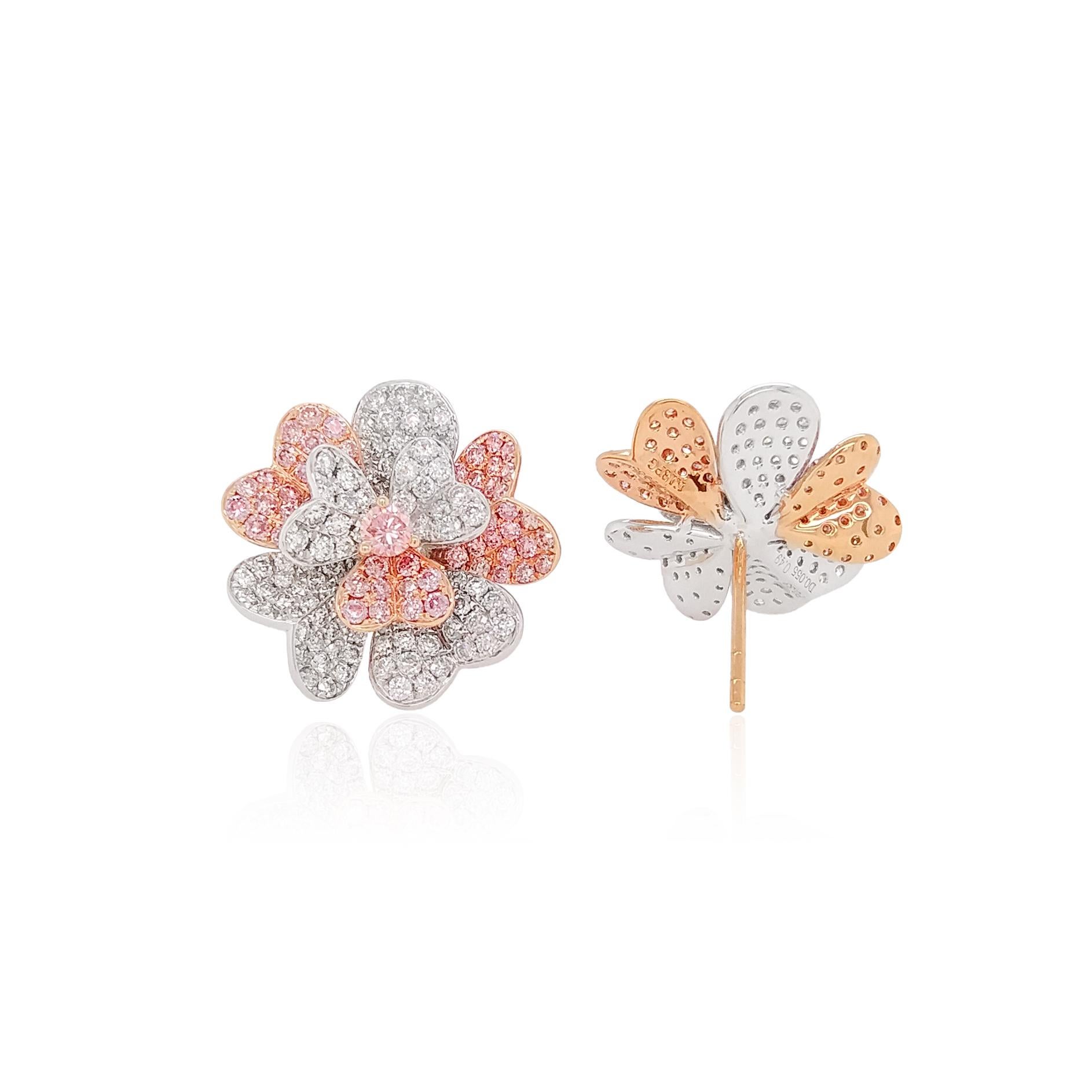 These floral Platinum earrings offer a subtle twist on a romantic design. Featuring a soft natural Argyle Pink Diamond at its centre, set amongst scintillating Argyle Pink Diamonds and sparkling White Diamond heart-shaped petals. These pretty