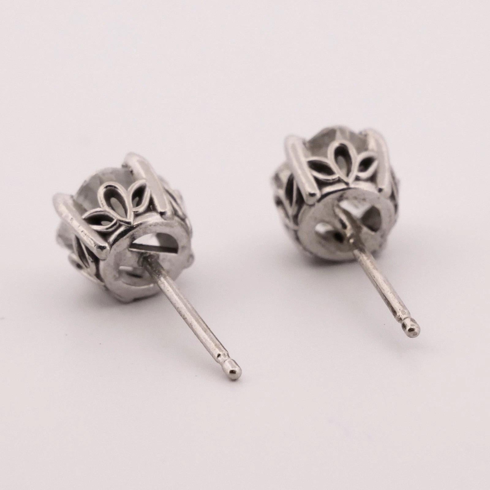 🡆 Item Description:
Offered is a pair of natural diamond stud earrings set in 14K white gold four-prong friction settings. Each earring holds one (1) round brilliant cut diamond, tested and confirmed natural. Together, the earrings weigh 1.34 grams