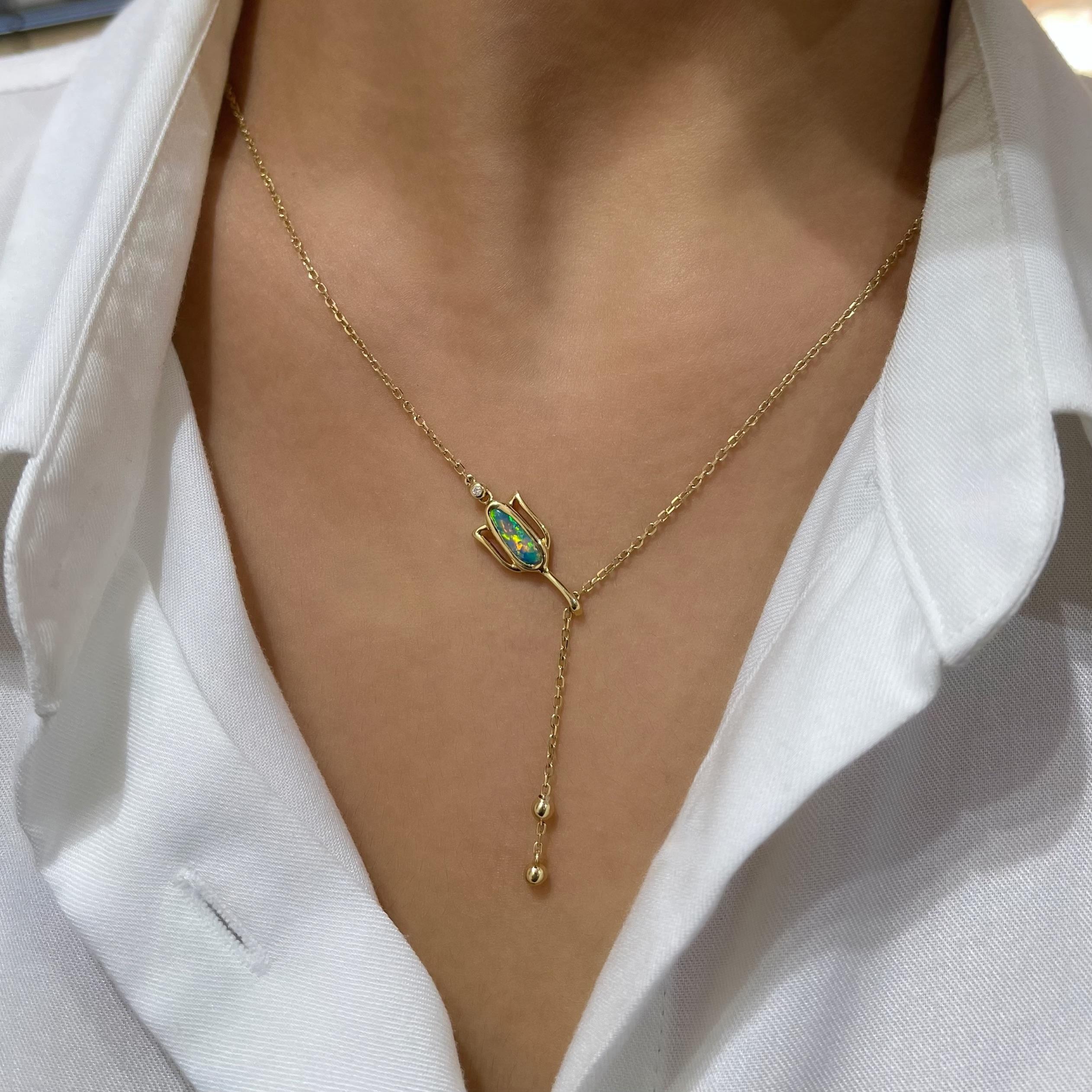 “Fairy’s Tulip” opal pendant is Tinker Bell’s best kept secret. A magical black opal (0.51ct) set in 18K yellow gold is topped with a shiny diamond. This enchanting jewellery piece features a chain that adjusts to different lengths and is finished