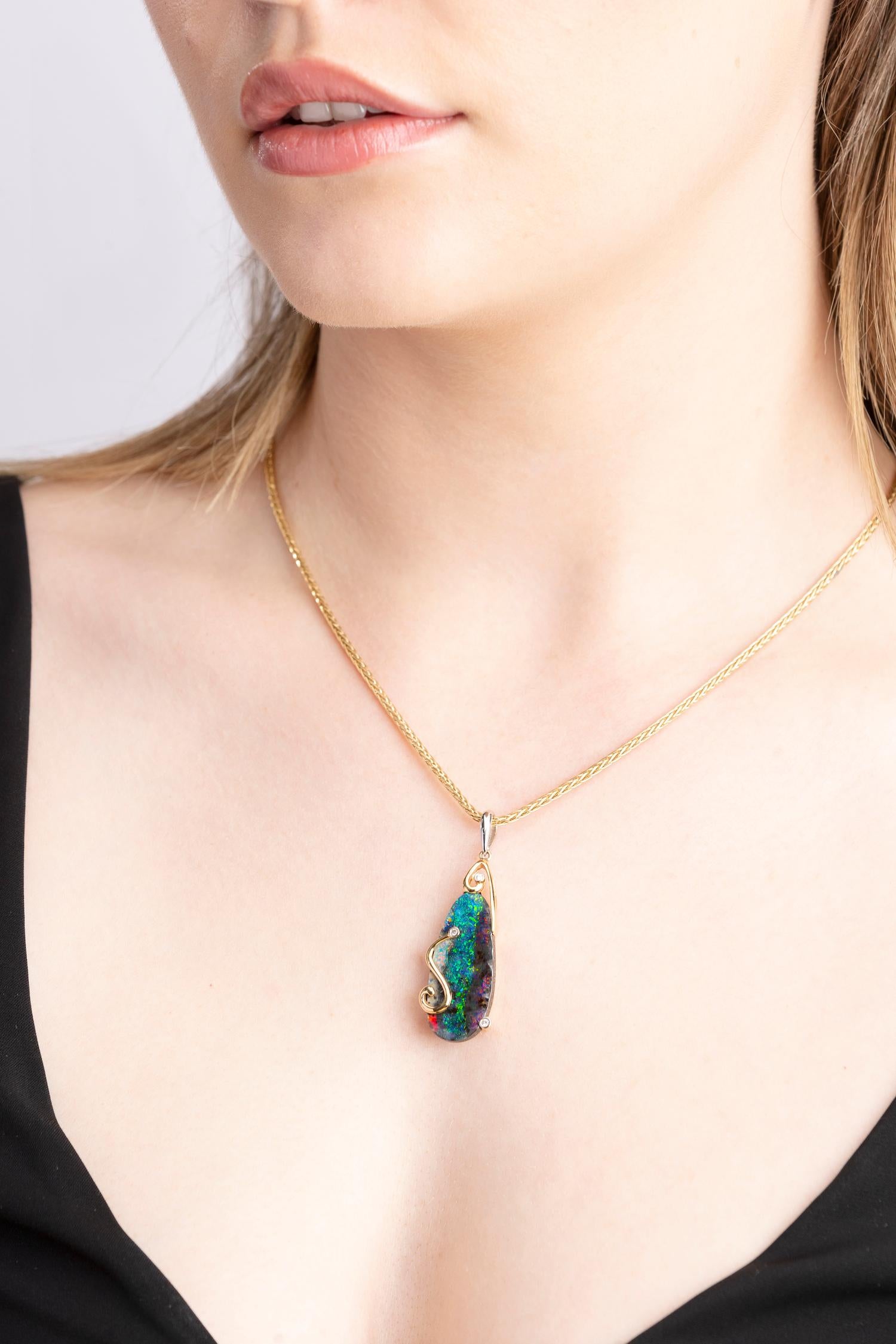 “Sweet Soul” opal pendant expresses opulence and regal elegance featuring a striking boulder opal (19.90ct) sourced from Winton, Australia. Set in our graceful 18K yellow gold with mesmerising diamonds, the elegant blue-green hues in the gemstone
