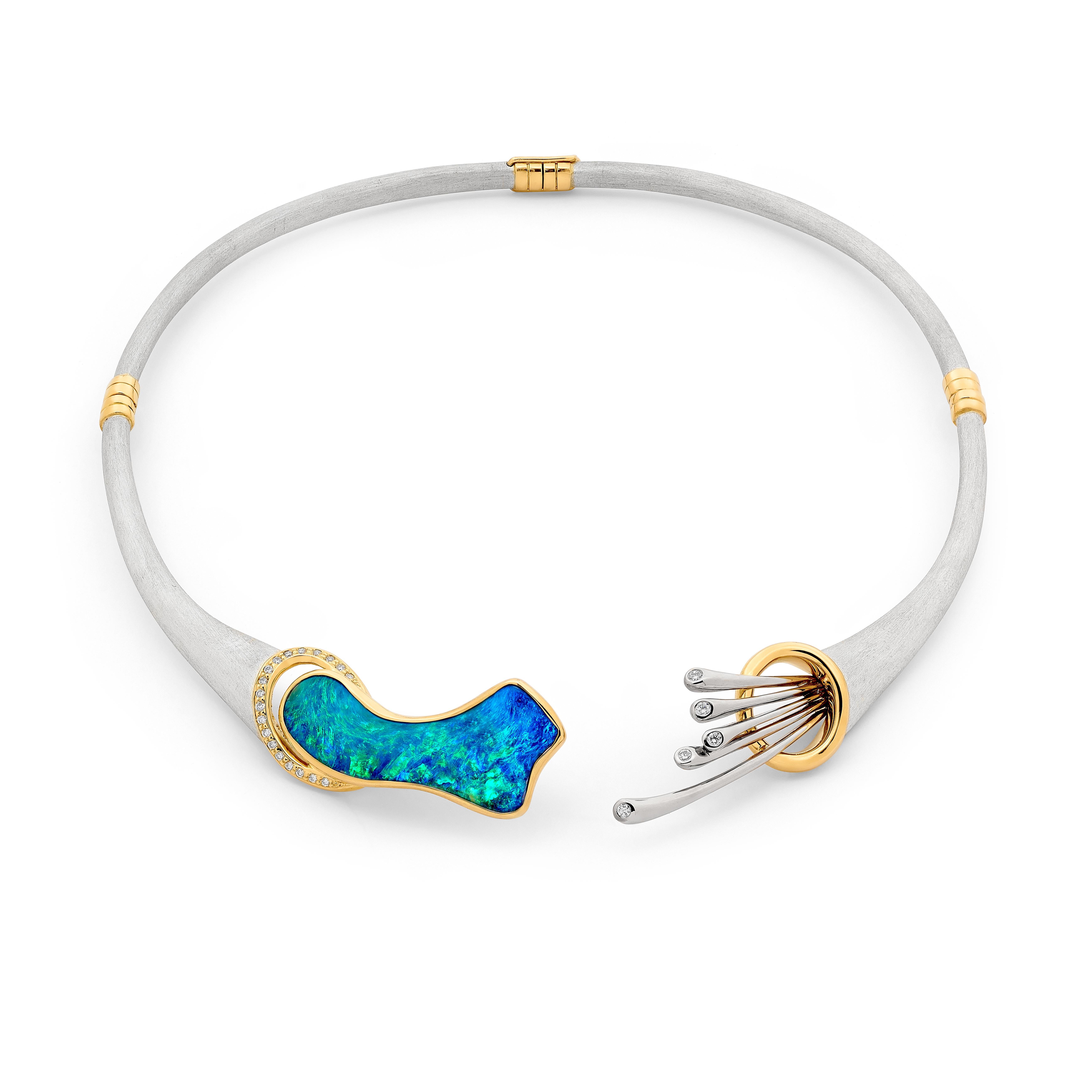 Graceful and utterly radiant is the wearer of the exquisite ‘Eirene’ boulder opal (26.45ct) necklace as she charms the world with her unwavering and strong spirit. Superbly handcrafted out of 18K gold and sterling silver to hold 26.45ct opal from