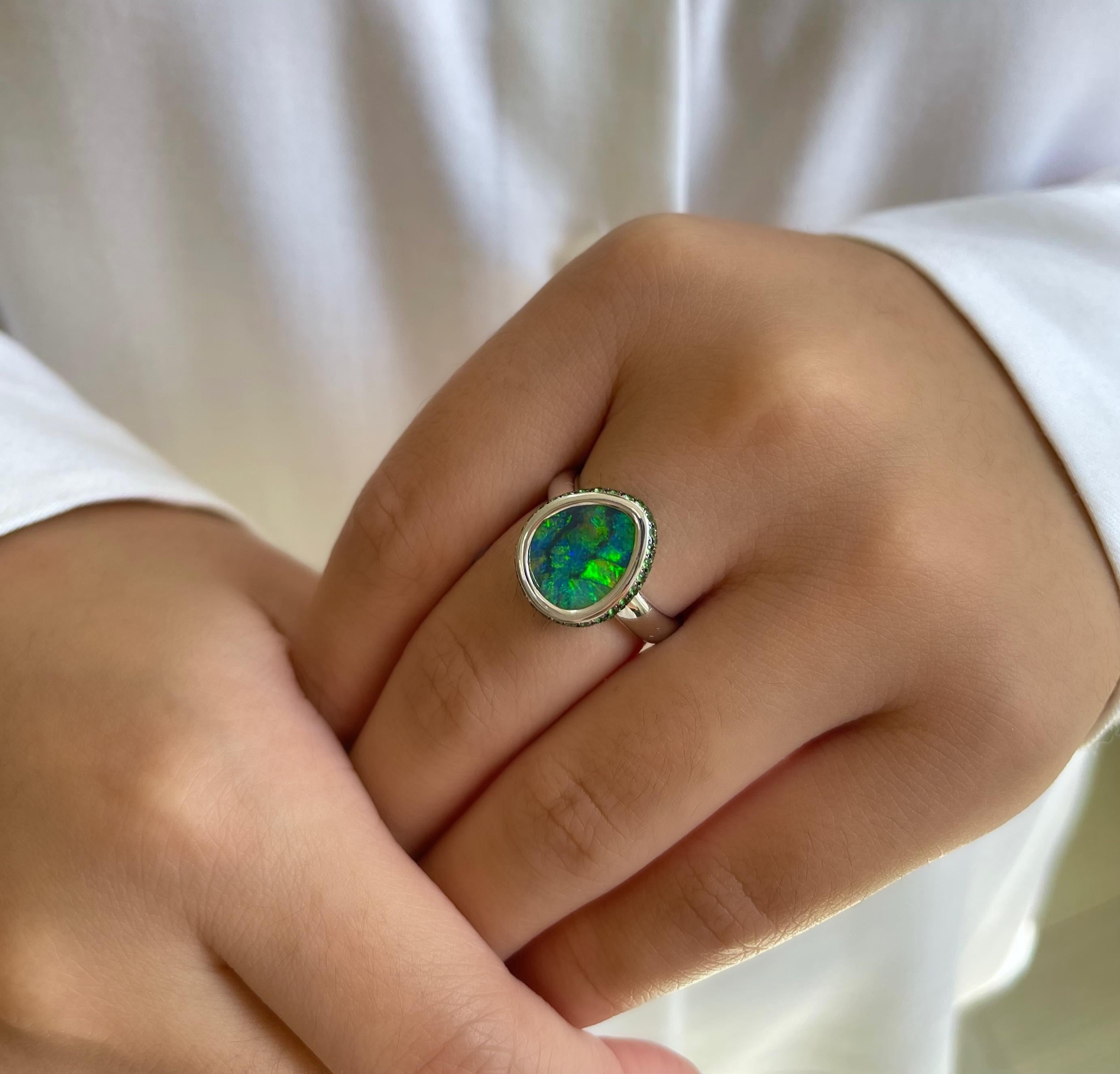 “Moonlight Rendezvous” has all the mystique of a secret assignation. The striking pattern of the black opal (3.85ct) from Lightning Ridge is heightened by the subdued twinkle of rows of tsavorites and the cool 18K white gold setting. Perfect for an