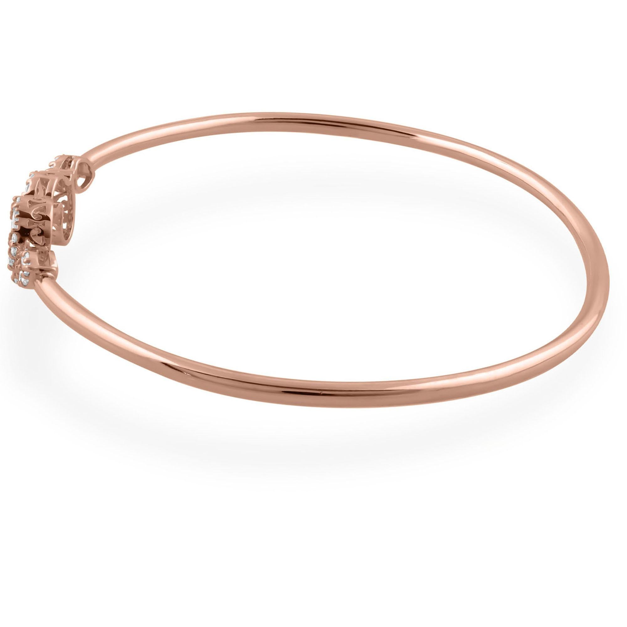 The bangle design adds a modern twist to this classic piece, ensuring a comfortable and secure fit while allowing the beauty of the diamonds to take center stage. Whether worn alone as a statement piece or stacked with other bracelets for a more
