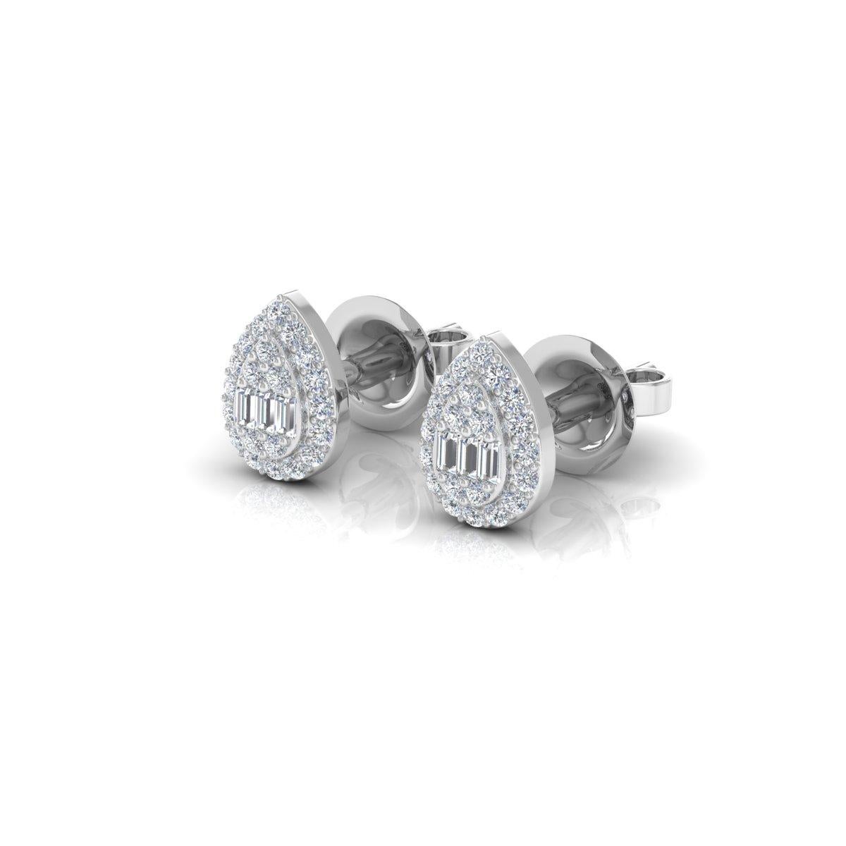 The baguette diamonds, with their sleek and elongated shape, create a sense of modern elegance, while the round diamonds add a touch of classic brilliance and sparkle. Set within the lustrous embrace of 14 Karat White Gold, these diamonds radiate a
