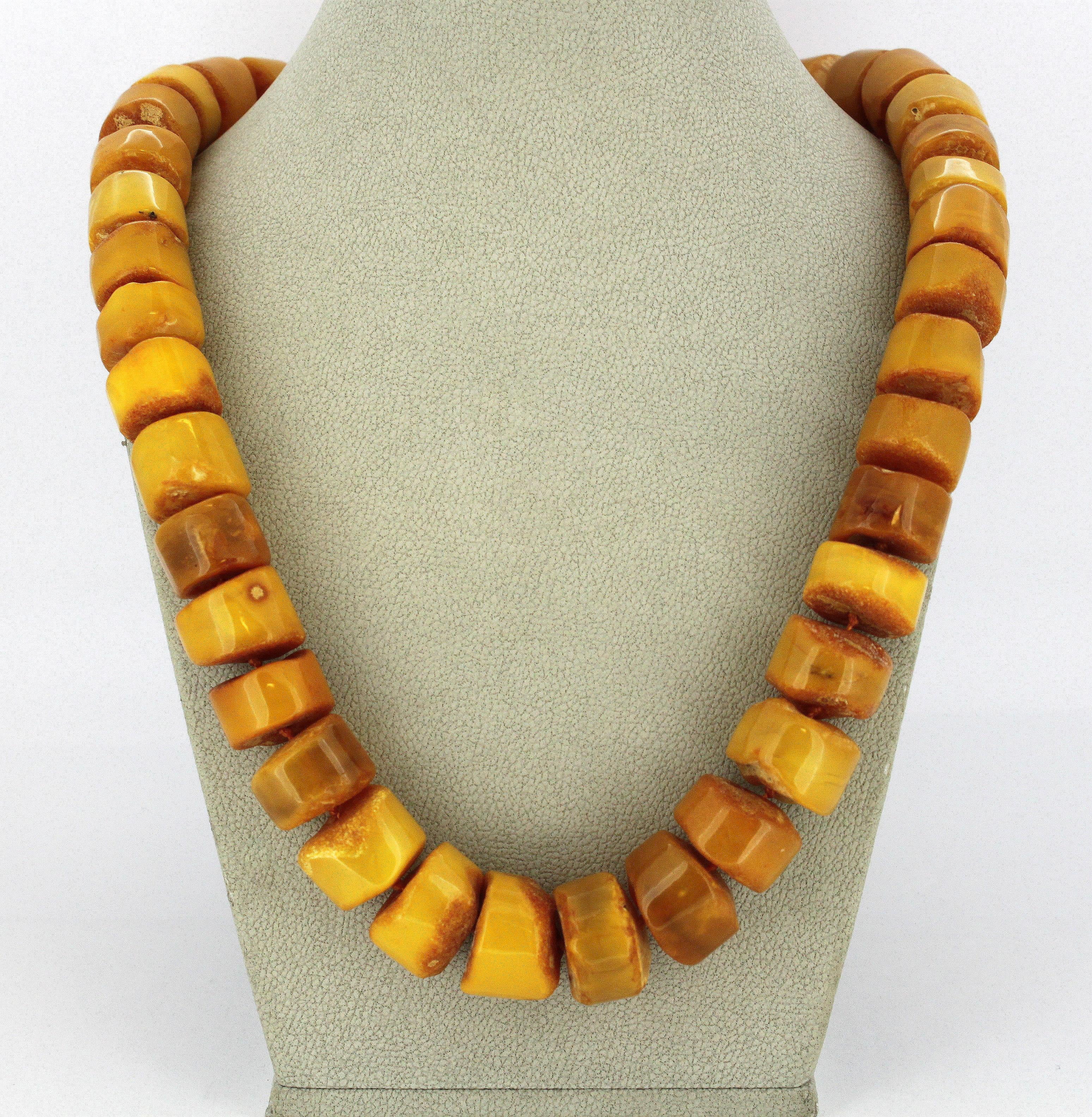 Natural Baltic amber necklace in the form of half polished tablets, with sterling silver clasp.
Hallmarked 925.
Circa 1950's

Dimensions -
Length : 52 cm
Width : 1.9 cm
Weight : 80 grams

Amber - 
Treatment : Natural

Condition: Pre-owned, general
