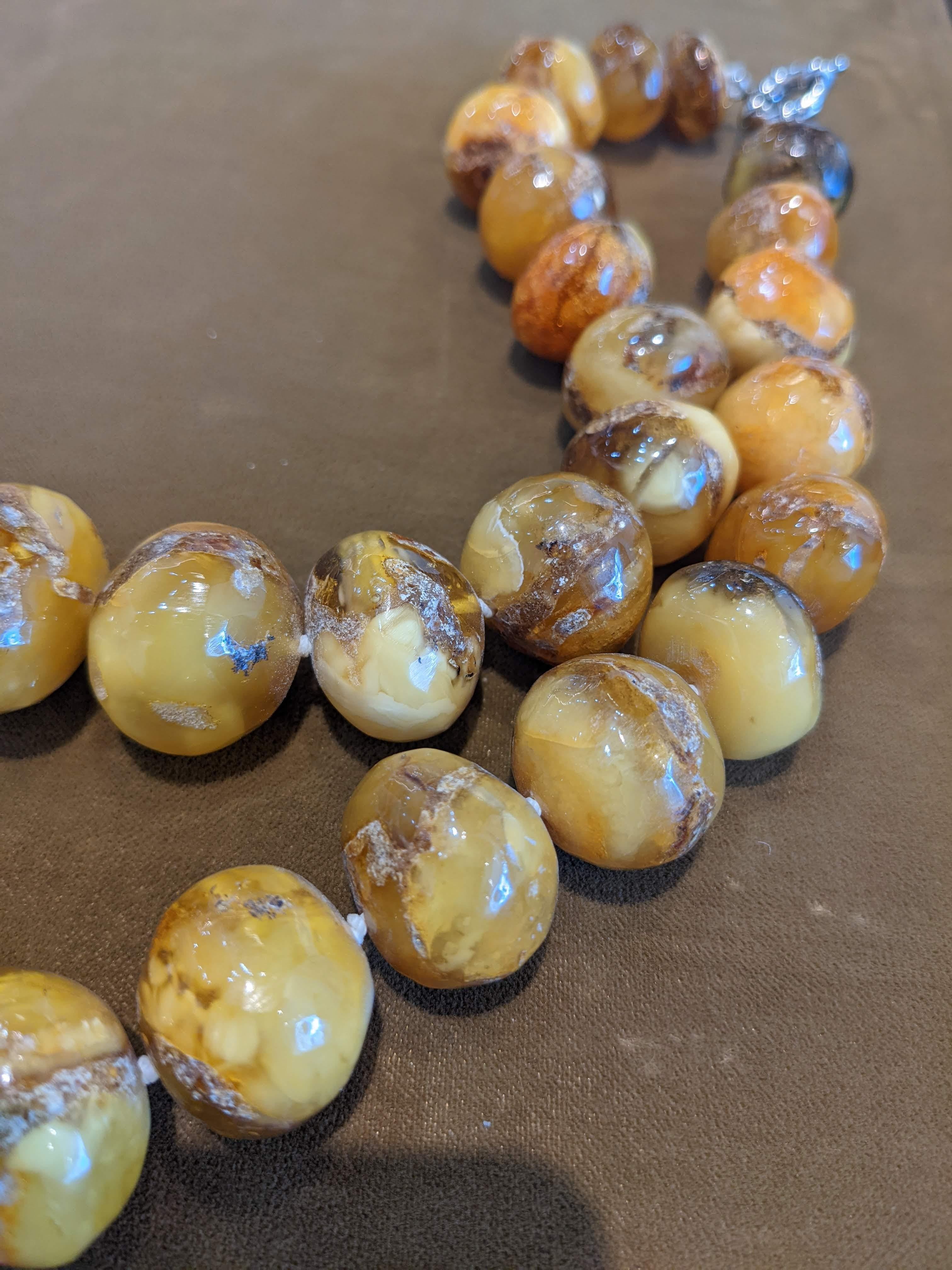 All Natural Rough Cut Baltic Amber Beaded Necklace with 925 sterling silver clasp.
19'' inches long (not including clasp).
113 grams total weight.
Beautiful honey and caramel tones with natural inclusions and colour ranges within each bead. 