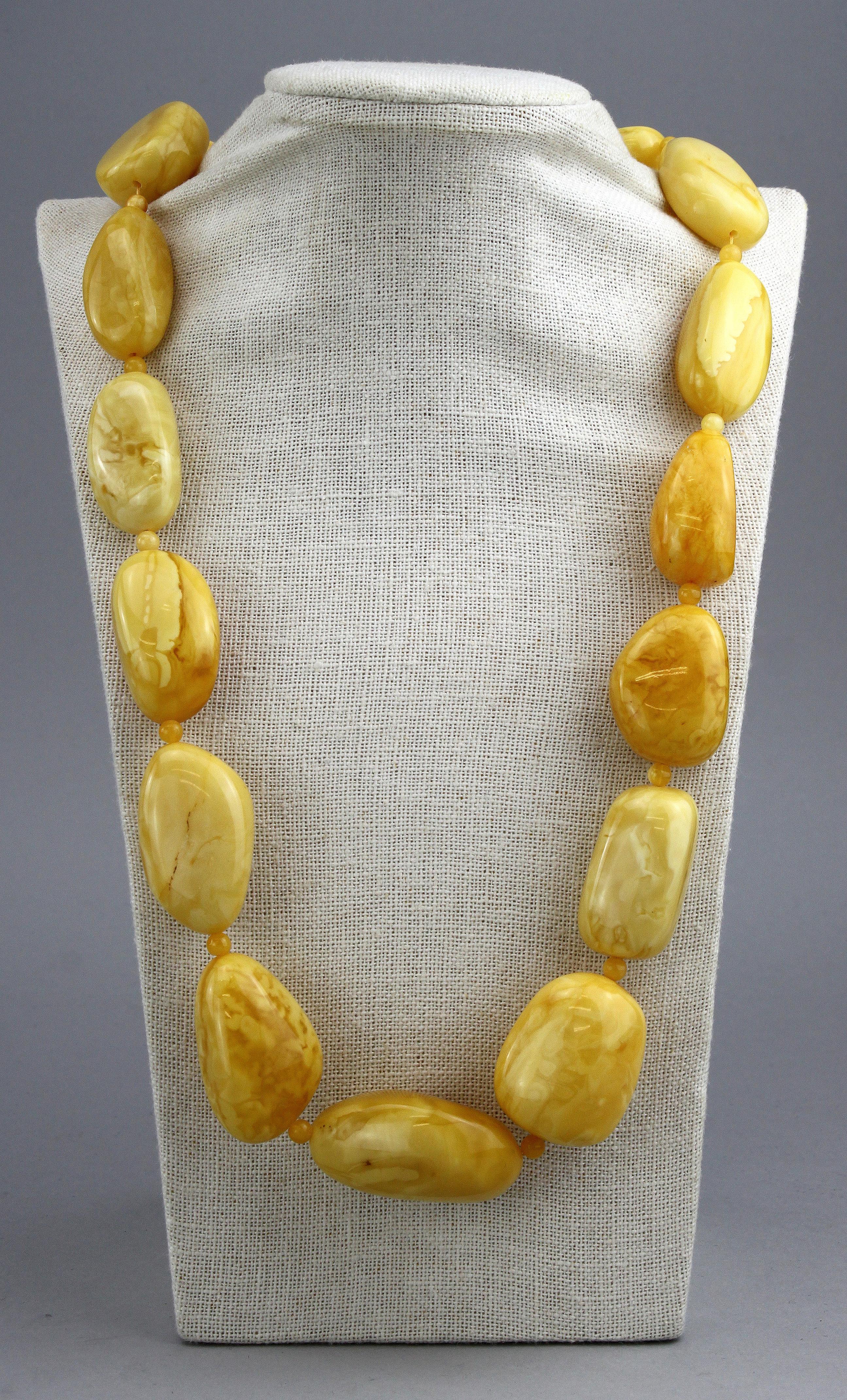 Natural Baltic white amber necklace.
Circa 1950's

Dimensions -
Length : 82  cm
Width : 3 cm
Weight : 160 grams

Amber - 
Treatment : Natural
Large Amber Stone Size : 4.5 x 2.8 x 2.1 cm
Medium Stone Size : 4 x 2.5 x 1.5 cm

Condition: Pre-owned,