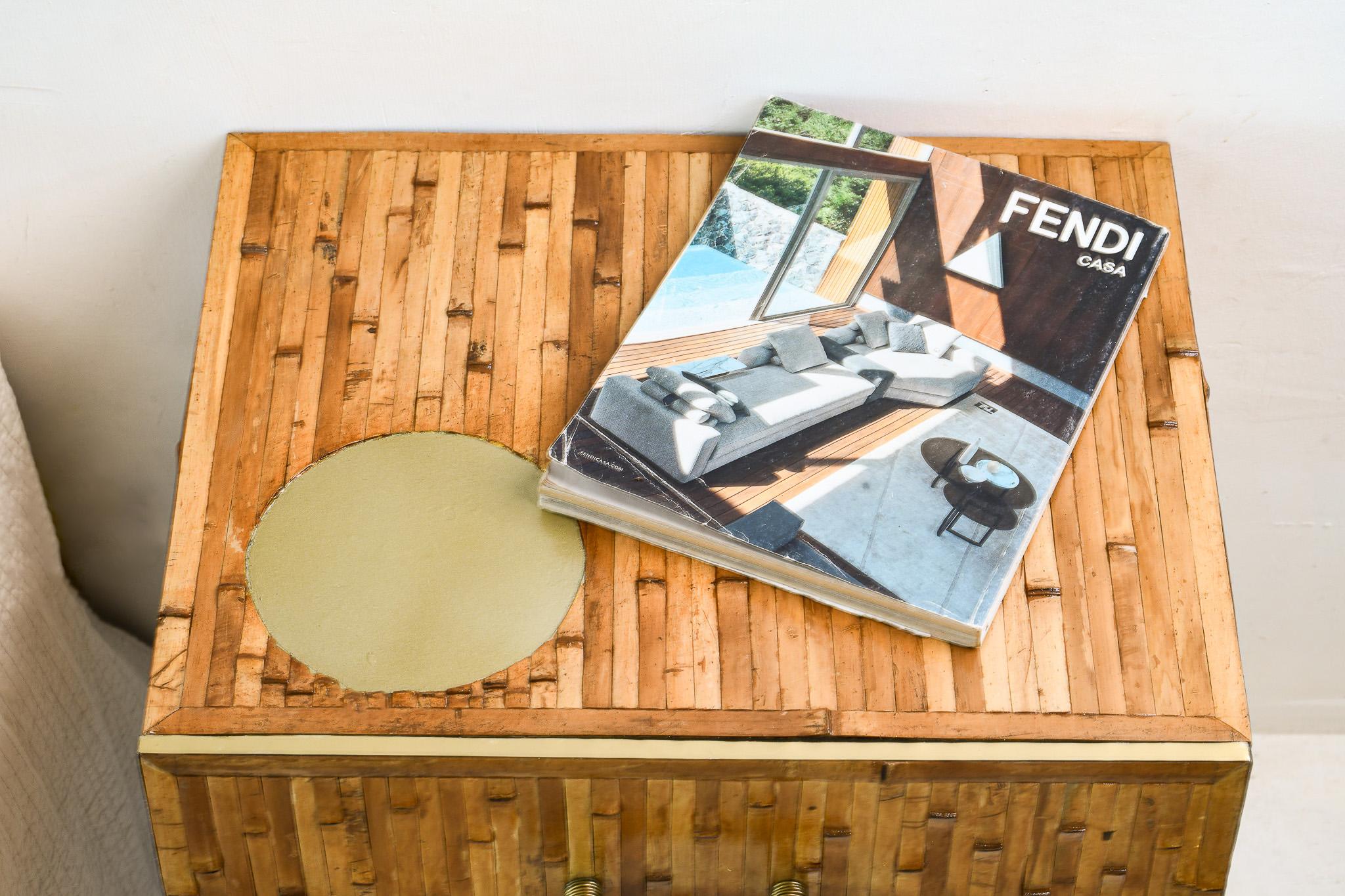 This bamboo wall-mounted nightstand showcases elegant mid-century influences, blending natural warmth with sleek sophistication. It's clean lines and minimalist form are complemented by brass detailing, adding a touch of vintage charm. The rich