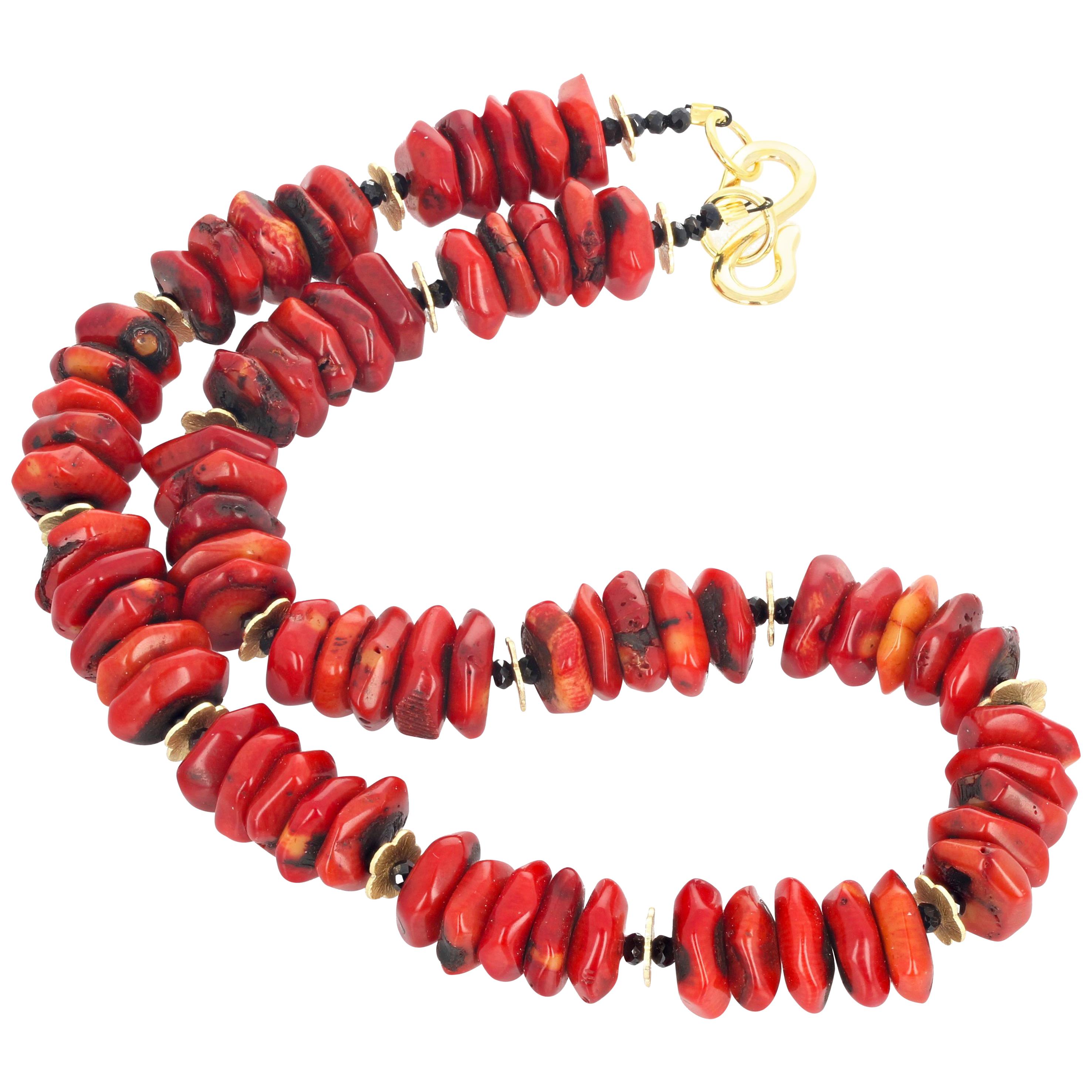 These beautiful polished rondels of Bamboo Coral average approximately 14 mm and are enhanced with golden rondels and sparkling black Spinel gems and are set in an 18 inch long necklace with goldy hook clasp.