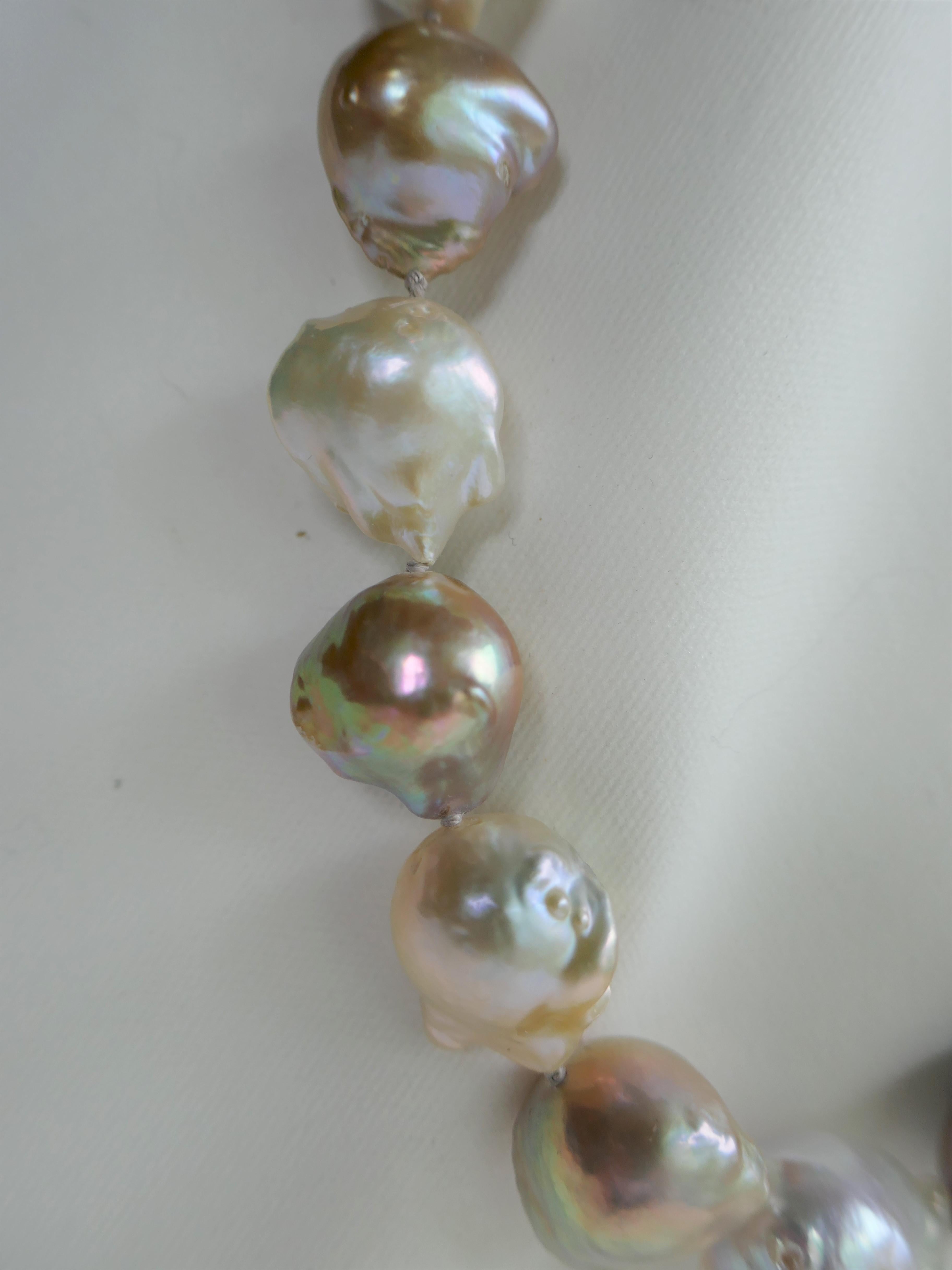 This natural color baroque cultured pearl necklace is absolutely beautiful. This is a statement necklace. The baroque cultured pearls are natural tones with golden, white, beige tonality. The pearls have great luster.  The necklace is individually